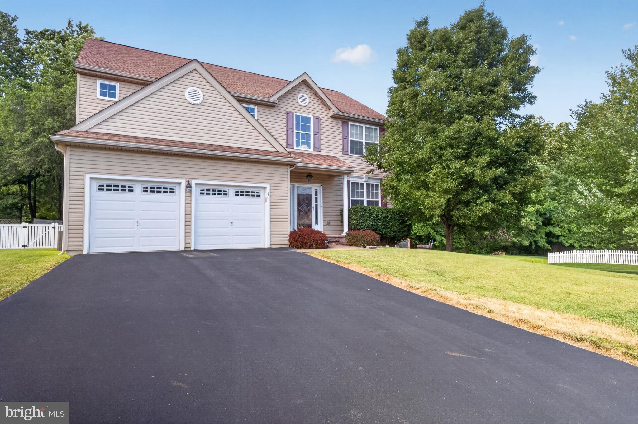 Welcome to 10 Buck Lane! This beautiful, 18 years young home offers Brazilian cherry hardwood flooring, an open staircase, and a spacious layout designed for everyday living and entertaining. The remodeled kitchen features a center island, coffee station, tile backsplash, 42” cabinetry, stainless steel appliances, and opens directly to the family room with a propane fireplace. Formal living and dining rooms showcase hardwood floors, chair rail, and tray ceilings.
Upstairs, the spacious primary suite offers a large walk-in closet and private bath with double granite vanity, soaking tub, and separate shower. Additional bedrooms feature ample closet space, ceiling fans, and abundant natural light.
The finished walk-out basement includes a family room, workout nook, full bath, and plenty of storage. Enjoy outdoor living on the large deck overlooking the partially fenced yard. The park is conveniently located right next door which makes having little ones over a breeze!
Major updates include HVAC (2021), water heater (newer), central air (approximately 2 years old), newer carpet, PEX plumbing with manifold system, sump pump, and replacement windows. Additional highlights include a 2-car garage with interior access and electric openers, first-floor laundry, and a patio area outside the basement entrance.