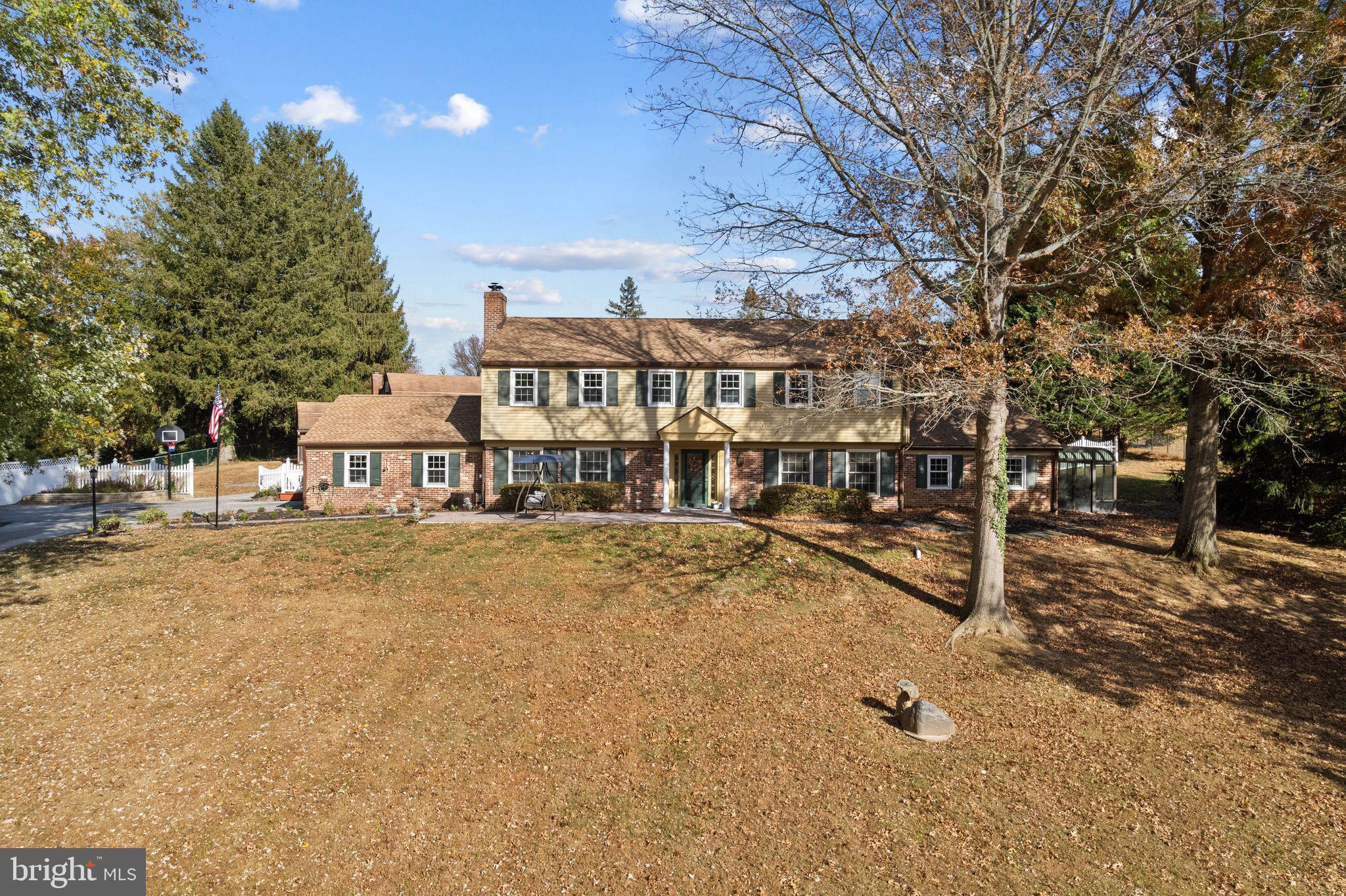 Nestled on a secluded 1.69-acre lot, on one of the most picturesque cul-de-sacs in Thornbury Township, this stunning Colonial-style home offers a rare blend of classic elegance and tranquil country living.  As you drive down the peaceful tree-lined street, the beauty and privacy of the property immediately becomes apparent, making it the perfect retreat from the hustle and bustle of everyday life.  The Main Level offers a thoughtfully designed layout including a welcoming foyer that opens into a formal living room with fireplace and adjacent formal dining room featuring custom millwork - perfect for hosting dinner parties or family gatherings. The large, sun-filled family room on this level is a true highlight, with expansive windows that overlook the beautiful backyard and pool. This inviting space also boasts a wood-burning fireplace and a convenient wet bar, ideal for entertaining guests or relaxing after a long day.  For movie nights or quiet downtime, relax in the movie room or adjoining sun porch that provides a peaceful spot to enjoy a cup of coffee or take in the views.  Also on this level is a private office, tucked away for quiet work or study.  The eat-in kitchen offers plenty of space for both cooking and casual dining. The den provides a comfortable, relaxed space for gathering.  A full bath on the first floor adds convenience and functionality.  The Upper Level includes a spacious Primary Suite complete with a full bath, walk-in closet, and sitting area or exercise room. Three additional generously-sized bedrooms plus a full hall bath round out this level.  The home’s outdoor living spaces are just as impressive as the interior.  Step outside and enjoy your own personal oasis, complete with an in-ground pool and gazebo, perfect for summer lounging or hosting friends and family. The expansive backyard is an idyllic setting for outdoor activities, whether you're enjoying peaceful mornings on the patio or hosting a BBQ.  A sizable detached barn/garage with loft and vehicle service pit adds an extra layer of versatility to the property.  Whether you use it as a workshop, additional storage, or even as a studio, the possibilities are endless.  Located in one of the most desirable areas of Thornbury Township, this home offers the perfect balance of seclusion and convenience. While tucked away in a peaceful cul-de-sac, it’s just minutes from local shops, dining, and major highways, providing easy access to all the best the area has to offer.  This exceptional home offers comfort, style, and tranquility - the perfect place to call home!