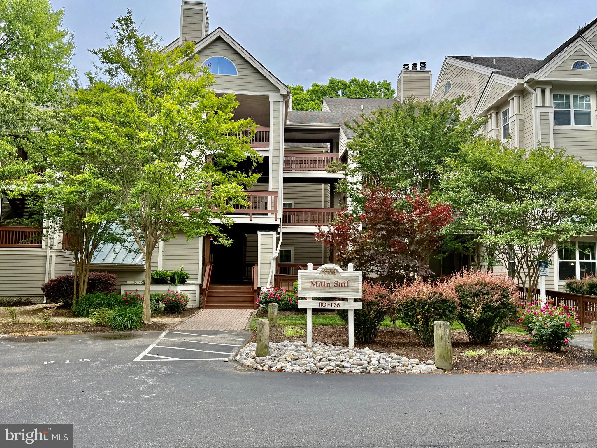 Welcome to easy waterfront living in the sought-after gated community of Solomons Landing! This beautifully maintained main-level condo offers peaceful views of Back Creek and a resort lifestyle that feels like a year-round getaway.

Step inside to an open and inviting floor plan featuring a spacious great room with custom built-in shelving and a cozy wood-burning fireplace—perfect for relaxing evenings at home. The great room flows seamlessly into the kitchen, complete with abundant cabinetry, a breakfast bar, and a dedicated dining area, making entertaining effortless.

A versatile den provides the perfect space for a home office or guest room and opens to a screened porch where you can unwind while overlooking tranquil woods and the scenic creek. The primary suite offers a private retreat with an updated ensuite bath, while an additional bedroom, full hall bath, and in-unit laundry add comfort and convenience.

Enjoy resort-style amenities including pickleball, tennis and basketball courts, a fitness center, swimming pool, clubhouse, walking trails, golf putting green, playground, car wash set up, electric vehicle charging station, picnic areas and community docks—bringing waterfront living right to your doorstep.

Located just minutes from everything Solomons, Maryland has to offer—restaurants, marinas, shops, and more—this is your opportunity to live the Chesapeake Bay lifestyle you’ve been dreaming of.