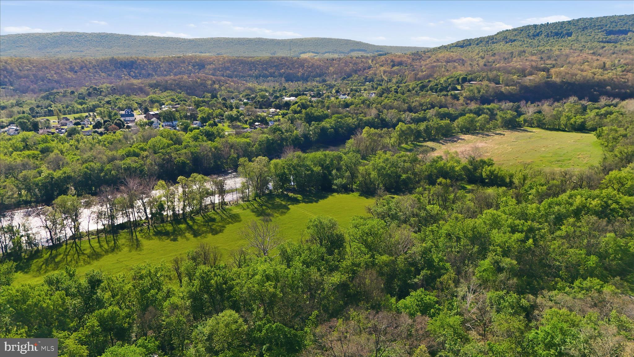 NEW PRICE!! A rare offering of approximately 340 contiguous acres along the Potomac River, this expansive tract combines privacy, natural beauty, and long‑term potential. With roughly 50 acres of level, usable riverfront, the property is well‑suited for recreation, outdoor hospitality concepts, or future low‑impact campground development. Its direct adjacency to federally protected C&O Canal lands enhances both privacy and conservation value, creating a unique setting that feels remote yet accessible.
Land Features
340± total acres, contiguous and diverse in topography
50± acres of flat, accessible riverfront ideal for recreation or future development
Bordered by C&O Canal National Historical Park, ensuring protected surroundings
Portions of the property have been recently timbered, offering improved access and long‑term forestry value
No residential dwellings; an unoccupied mobile home with well and septic remains on site
Use Potential
The combination of river frontage, level ground, and proximity to protected land makes this property a st