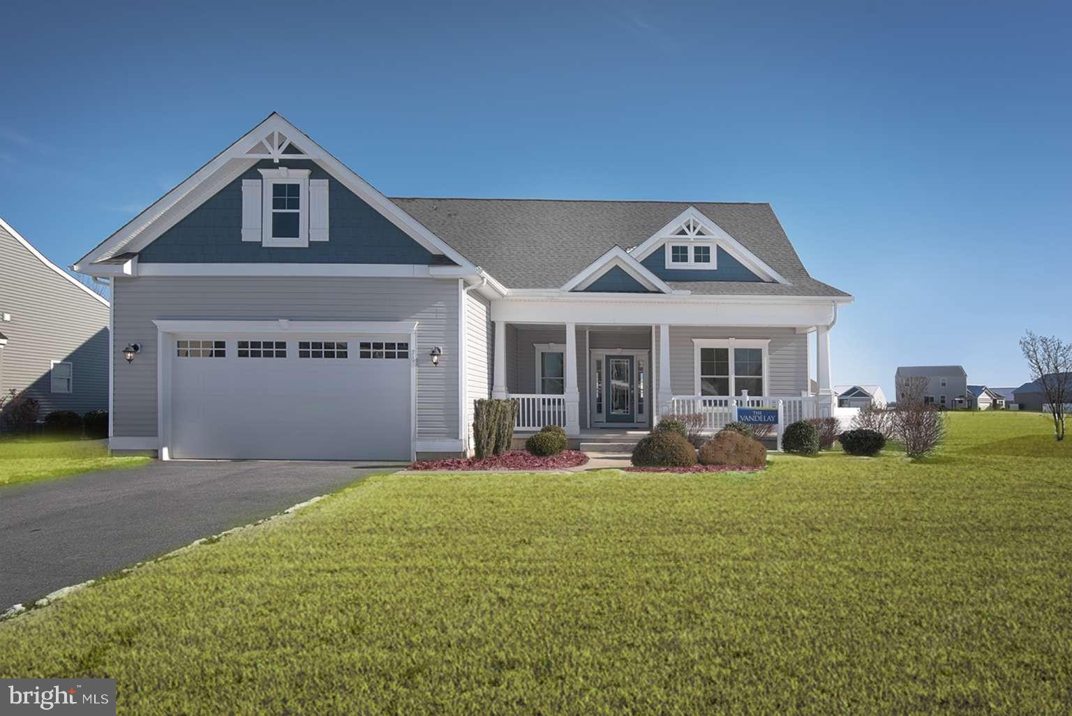 A beautifully designed former model home featuring spacious single-level living, an open split-bedroom layout, and thoughtfully selected upgrades throughout. This VANDELAY combines large gathering spaces, vaulted ceilings, designer finishes, and exceptional kitchen storage into a home that feels much larger than its footprint. The owner's suite is privately located opposite the guest bedrooms, creating separation and comfort for both homeowners and visitors. Situated on a 3/4+ acre homesite with public water and sewer, this home also features a super low HOA fee. Furniture, décor, and furnishings are not included. [MAIN LIVING]: Spacious open-concept layout; Split-bedroom design; Vaulted living room ceiling; 4-foot rear extension; Gas fireplace; Designer lighting; Additional recessed lighting; Luxury vinyl plank flooring. [KITCHEN & BATH]: Exceptional kitchen cabinet storage; Kitchen island with cabinetry; Tiled backsplash; Under-cabinet & over-cabinet lighting; Tiled owner’s shower; Tiled bench seat in owner’s bath. [OTHER FEATURES]: Large front porch; 3/4+ acre homesite; Irrigation with separate well; Garage service door; Dual fuel HVAC system; Public water and sewer; Super low HOA fee.