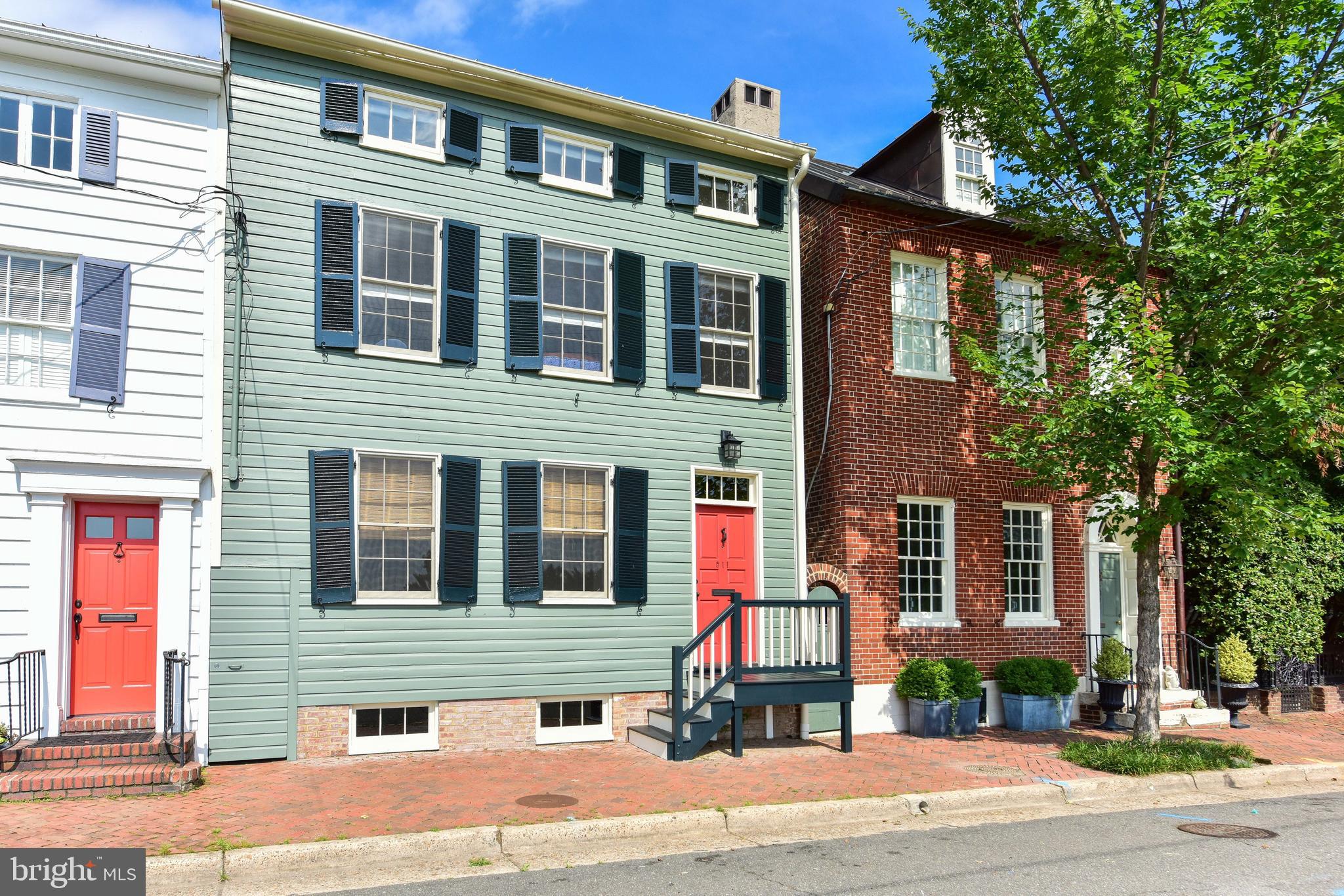 Overlooking Windmill Hill Park on one of Old Town's most sought-after blocks, this 5-bedroom stunner offers unobstructed panoramic views of the Potomac River.  Built in 1820, this historic home was meticulously renovated with improvements that incorporate modern amenities while preserving its original charm.  Original floors, interior trim, and windows have all been carefully restored to original conditions rarely found in historic homes.  Top quality Farrow and Ball paint has been applied inside and out. An expanded kitchen boasts premium appliances, Italian Carrara marble, and radiant heated floors.  Carefully hidden to preserve the home's architectural integrity, six independent climate zones were added throughout to provide efficient comfort.  A centrally located wood-burning fireplace in the dining room delivers natural heat and aesthetic appeal. Exposed historic brick, radiant heated floors, high ceilings, windows and a graduated exit stairwell will make this basement one of the most unique features of this home.  With custom cabinetry and built-ins throughout, the overall layout is both cozy and convenient, incorporating plenty of storage such as his/her master bedroom closets and an attic for storage.