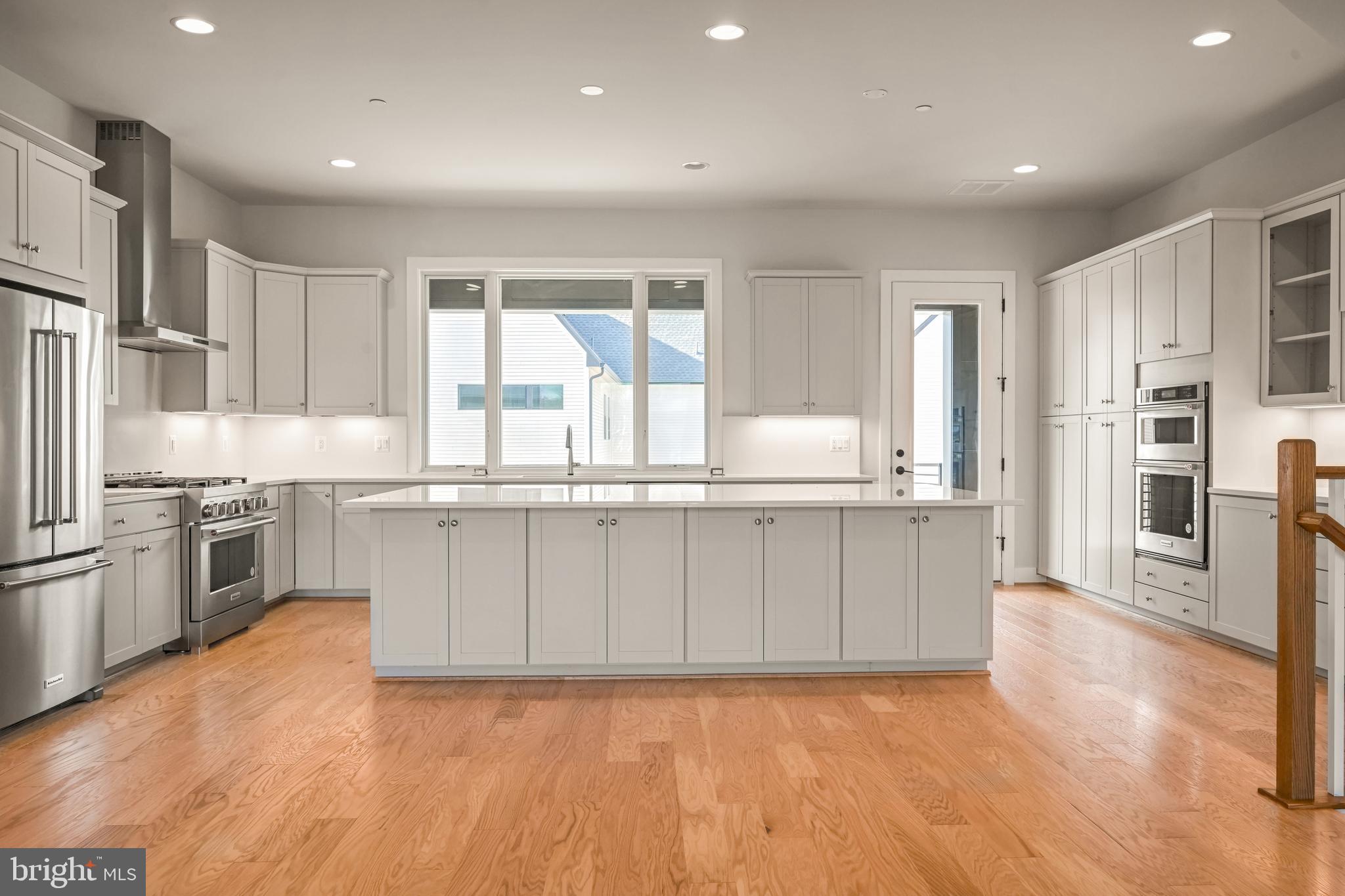 The bright and airy main living level offers a light-filled great room with gas fireplace, spacious dining room, and a large rear kitchen that opens to the outdoor living space. The Chef’s dream kitchen is complete with Frost White quartz countertops, Stone Gray cabinets, enormous island accented with Admiral cabinets, and KitchenAid stainless steel appliances. The second floor boasts a luxurious primary suite with huge walk-in closet, two large secondary bedrooms and a conveniently located laundry room. The lower level features a spacious rec room and full bath. This home is on a desirable homesite overlooking the park. Photos shown are of the Ainsley model.