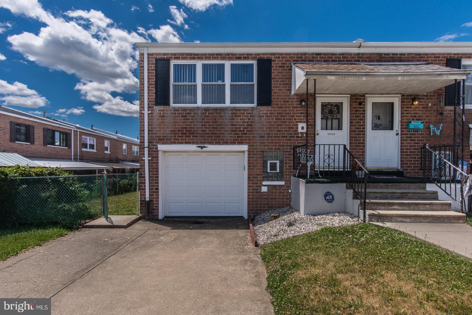 Go ahead—slam on the brakes and pull over, because this is the one that deserves a second look! They say real estate is all about location, and this end-of-row all brick home proves it. Located on a quiet street in the desirable Millbrook Neighborhood, this well-maintained 2-bedroom, 1.5-bath home also offers a finished basement with a bonus room, plus a great combination of side and rear yards with a covered patio. It's the kind of home that's sure to become a favorite on your list. Let's dive into the details. Starting with off-street parking for three—yes, three—vehicles! You'll have an attached one-car garage with inside access to the lower level, plus a two-car driveway. Step inside to the main level, where you'll find a recessed foyer entrance leading into a spacious living room filled with natural light. The living room features wall-to-wall carpeting and a convenient pass-through window to the kitchen. Hardwood flooring extends through the dining area and hallway. The kitchen offers plenty of cabinet and counter space and appliances including a refrigerator, gas range, dishwasher, microwave, and kitchen cart. Down the hallway, you'll find two convenient closets—one for coats and one for linens—a nicely updated three-piece hall bathroom with newer fixtures and a mirrored cabinet, plus pull-down attic access for additional storage. The primary bedroom features wall-to-wall carpeting and an impressive amount of closet space. The second bedroom also offers wall-to-wall carpeting and closet. The finished lower level provides even more living space, complete with a gas fireplace and sliding glass doors leading to the covered rear patio with a hot tub, overlooking the spacious rear and side yards. Back inside, you'll find wall-to-wall carpeting, a convenient powder room, and additional closet space. The bonus room includes a bar with stools, making it the perfect spot to start entertaining right away. This level also provides inside access to the attached one-car garage and the dedicated laundry room. Additional highlights: 3534 Oakhill Road is conveniently located near public transportation, including SEPTA Routes 20 and 67. Commuters will appreciate the easy access to Woodhaven Road (Route 63), I-95 North and South, Route 1, and the Pennsylvania Turnpike. The home is also close to schools such as Archbishop Ryan, Benjamin Rush Arts Academy, and Holy Family University, as well as Jefferson Hospital, shopping, restaurants and churches.