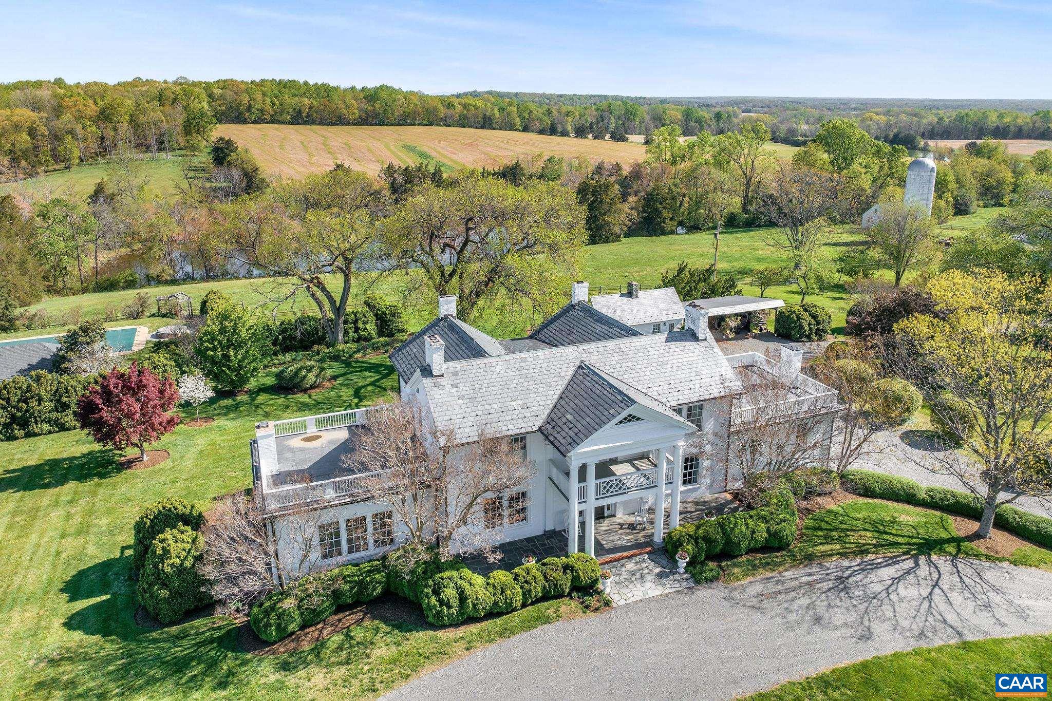 Set in the heart of bucolic Southern Albemarle amidst other noted properties, c. 1790 Liberty Corner and c. 1800 Scottland Farm offer a statement Virginia estate.  At the heart of this manicured, 1,888 acre property & set in absolute tranquility, is an historic residence in flawless condition that melds period charm w/ modern amenities.  Improved by 3 guest houses, pool, pool house and gardens, the home enjoys stunning, panoramic views of the rolling Virginia countryside and two large lakes.  A third, charming guest house aka 'The Lodge' looks over a third lake on the property.  Pristine farm improvements include an equestrian facility with indoor and outdoor arenas & 26 stalls, kennels complete with an office and trophy display room, two large hay barns that could be converted to dramatic event structures and numerous tenant or rental cottages ideal for staff or income. Rarely does such an incredibly well maintained, historic estate property reach the marketplace.  Truly, no stone has been left unturned by the owners in their careful stewardship of Liberty Corner & Scottland Farm. With multiple division rights, the property offers a significant Conservation Easement opportunity.  25 minutes to Charlottesville.,Fireplace in Bedroom,Fireplace in Dining Room,Fireplace in Family Room,Fireplace in Kitchen,Fireplace in Living Room,Fireplace in Master Bedroom