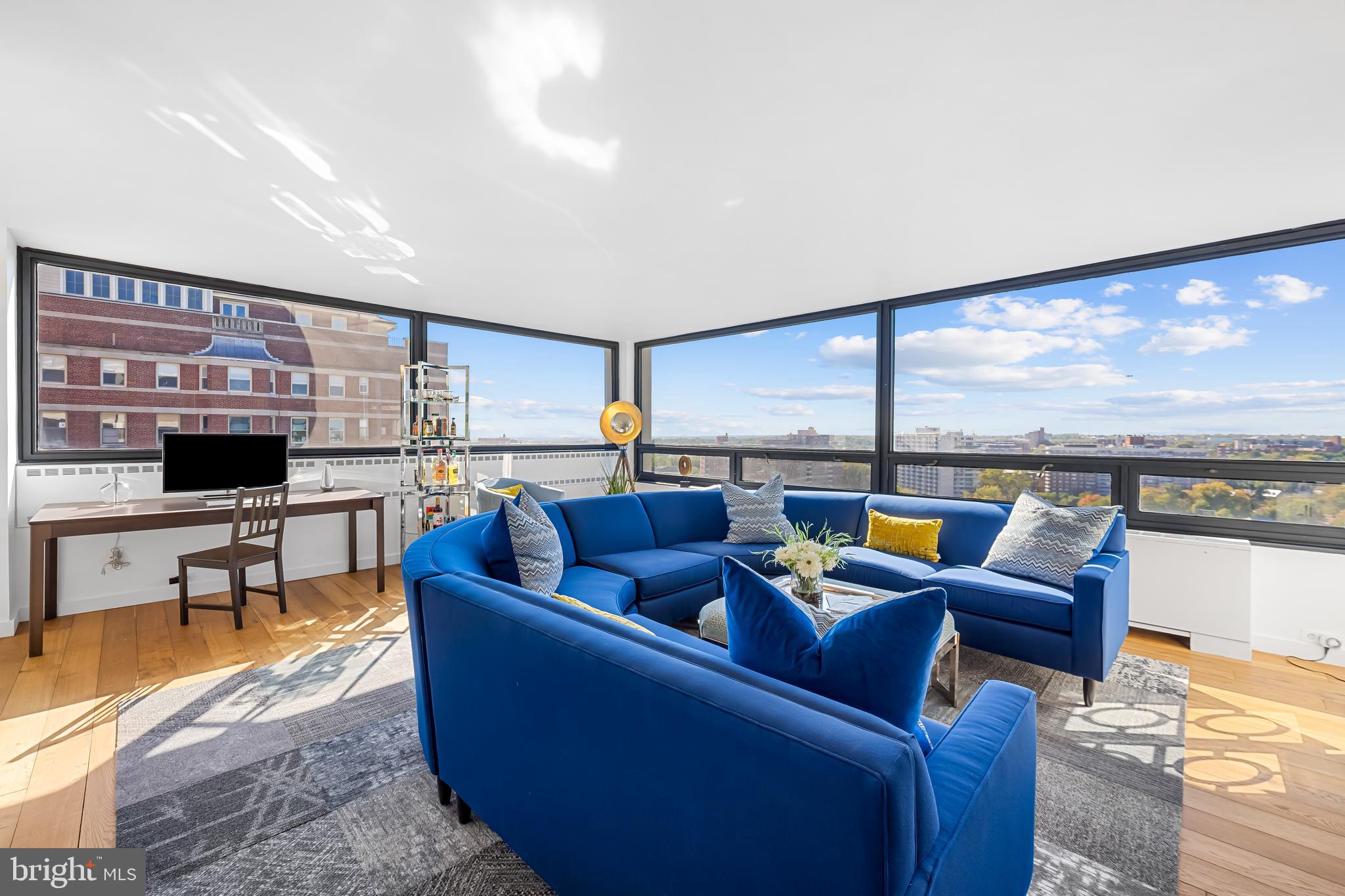 High above the beautiful and historic Guilford neighborhood, this rarely available sleek and contemporary corner unit captures panoramic skyline views of Baltimore City and beyond. The architecturally important and timeless structure with optional parking is located on a relaxed stretch of the renowned Charles Street Corridor offering convenient city living close to upscale dining, shopping, bustling sidewalks, museums, parks and Loyola, Notre Dame of MD, and Johns Hopkins university campuses. Enter the grand two-story lobby and ascend to a sophisticated light-filled residence with remarkably long views from nearly every room. Features include deluxe PanTim French oak flooring throughout, a handsome kitchen with gas cooking, honed soapstone counters and stainless appliances, a primary bedroom with large walk-in closet and ensuite bath, plus second bedroom and adjacent bath with walk-in shower. Recently installed window film to reduce heat and glare assures enjoyment of the astounding views on the brightest of days. A multitude of amenities include 24/7 front desk attendant, front door valet for available garage parking, lower-level laundry facilities, extra storage spaces, spacious residents’ lounge with fireplace, fitness room, and seasonal outdoor swimming pool. Condominium fees include water, sewer, gas, heating, and air conditioning. Enjoy city living in this beautifully appointed move-in ready residence. Furnishings available for purchase.