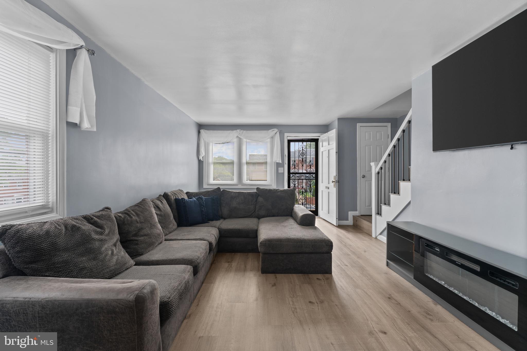 Welcome to this beautifully updated brick end-of-group townhome, offering the perfect blend of classic exterior charm and modern interior upgrades. Situated on a classic sloping front yard, this home benefits from the added natural light and privacy that comes with an end-unit location.

Step inside to discover a bright, move-in-ready interior highlighted by durable wood-look flooring and crisp, neutral finishes throughout. The heart of the main level is the fully updated kitchen, which boasts rich dark cabinetry, sleek stainless steel appliances, a stylish tile backsplash, and ample counter space for all your culinary needs.

This home features 3 bedrooms and 2 full bathrooms beautifully refreshed showcasing a modern vanity and a custom-tiled shower surround.

Downstairs, the fully finished basement significantly expands your living footprint. This versatile lower level provides an excellent flexible space that can easily adapt to your lifestyle, whether you need a recreation room, a home office, or a dedicated fitness area.