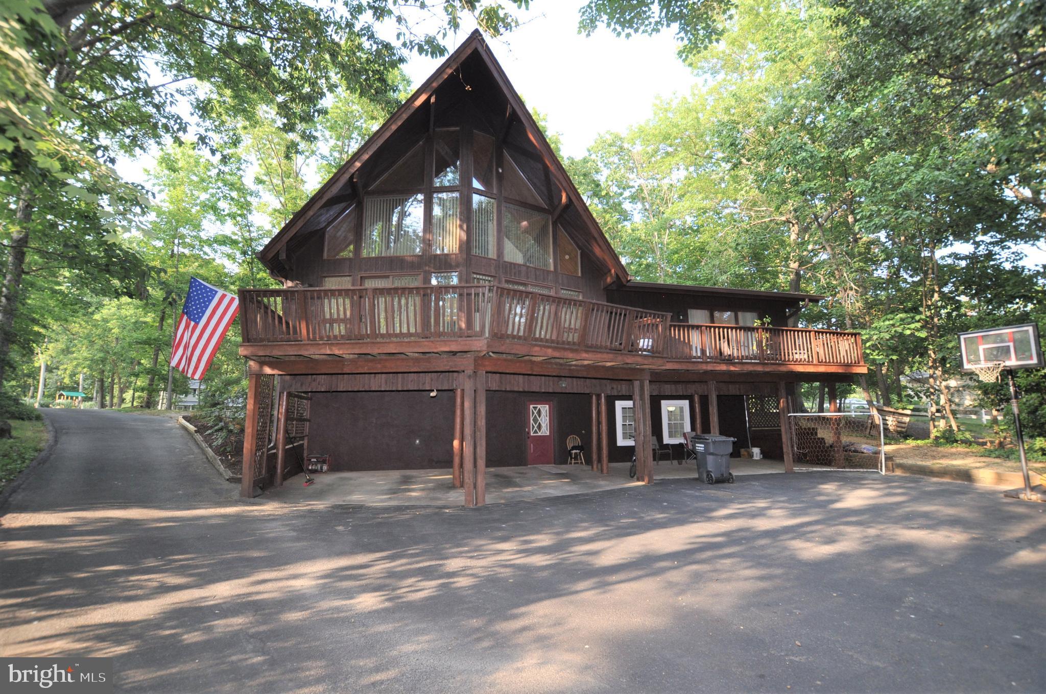 This Lindal Contemporary Cedar home has plenty of room for everyone.  Enjoy the floor to ceiling windows in the A-framed great room with soaring cathedral Wood ceilings, There is a loft overlooking the great room. Fully equipped kitchen comes with loads of cabinets with a pull-out pantry and ceramic tile floors. If you need extra table space or prep area, there is even a hideaway table in the cabinets! You ll enjoy the ample counterspace, too. There are two generously sized bedrooms and a full updated bathroom on the main level as well. There is even a built-in aquarium on the main level. The upper level features a master suite loft with  full master bathroom and a large cedar lined walk in closet. A full finished basement completes this package   there is a large family room and a private guest room with its own full bathroom   great for in-laws or as guest suite. Outside, there are ample sized decks all around, plenty of room for everyone to park on the huge asphalt driveway area (flat and perfect for basketball). New roof was put on in 2017There is over 7/10 of an acre on a quiet street and a shed as well. The entire exterior is freshly stained.  This home has a lot to offer   schedule your appointment to come take a look today!