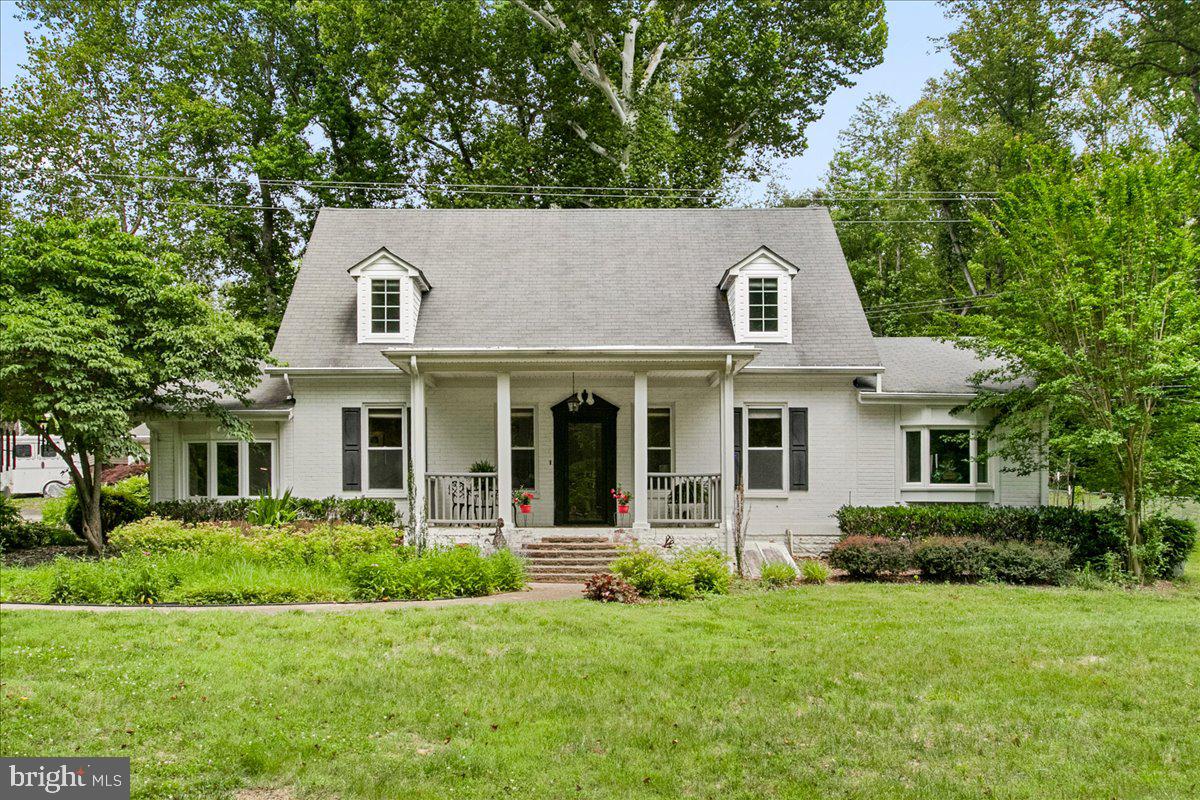 Tucked away at the end of a quiet cul-de-sac on a picturesque, wooded ¾-acre lot, this beautifully renovated Cape Cod offers the perfect blend of charm, privacy, and modern updates. Move-in ready home showcases gorgeous hardwood and tile flooring throughout.

The spacious floor plan includes 4 bedrooms and 3 full baths, with two bedrooms conveniently located on the main level, including an expansive primary suite with soaring 11-foot vaulted ceilings, a spa-like bath with separate soaking tub and shower, and peaceful wooded views. The inviting living room features a sparkling fireplace and opens to a stunning library/game room addition complete with custom built-ins and a separate private entrance — ideal for a home office, recreation room, or guest retreat.

The updated kitchen offers ceramic tile flooring, upgraded appliances, and charming details throughout. Lower level English Celler with lots of storage.

Outside, enjoy beautifully landscaped grounds with a stamped concrete patio, welcoming porches and walkways, a detached 2-car garage, and storage shed — all surrounded by a serene country setting just minutes from Quantico, the VRE, and I-95 commuter routes.