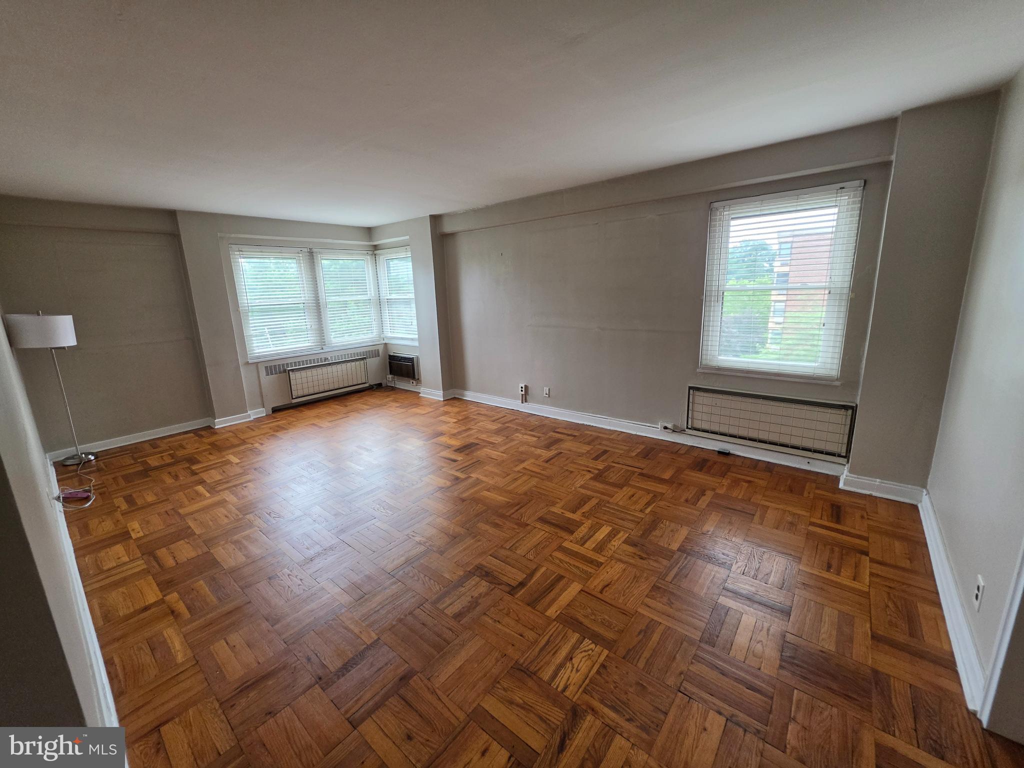 Corner One-Bedroom Condo in the Heart of Walkable Lansdowne!

Welcome to Wildman Arms, where comfort, convenience, and walkable living come together. This charming corner one-bedroom, one-bath condo is filled with natural light thanks to its desirable corner location and offers a warm, inviting place to call home.

Inside, you'll find beautiful parquet wood floors, a spacious eat-in kitchen, generous closet space, and bright living areas that create an easy, comfortable lifestyle. The secure mid-rise building features on-site laundry, resident parking, beautifully maintained garden plots, and optional garage parking for an additional fee.

Located in the heart of Lansdowne's historic one-square-mile village, you're just a short stroll from the soon-to-reopen Lansdowne Theatre, the popular Farmers Market, Lansdowne Library, local coffee shops, restaurants, boutiques, and art galleries. Commuters will appreciate the bus stop right outside the building and the train station just two blocks away, offering an approximately 15-minute ride to Center City Philadelphia or Philadelphia International Airport.

The monthly association fee includes water, sewer, lawn care, snow removal, and trash service, making homeownership simple and low maintenance.

Enjoy the perfect blend of small-town charm, walkability, and easy access to everything the region has to offer.