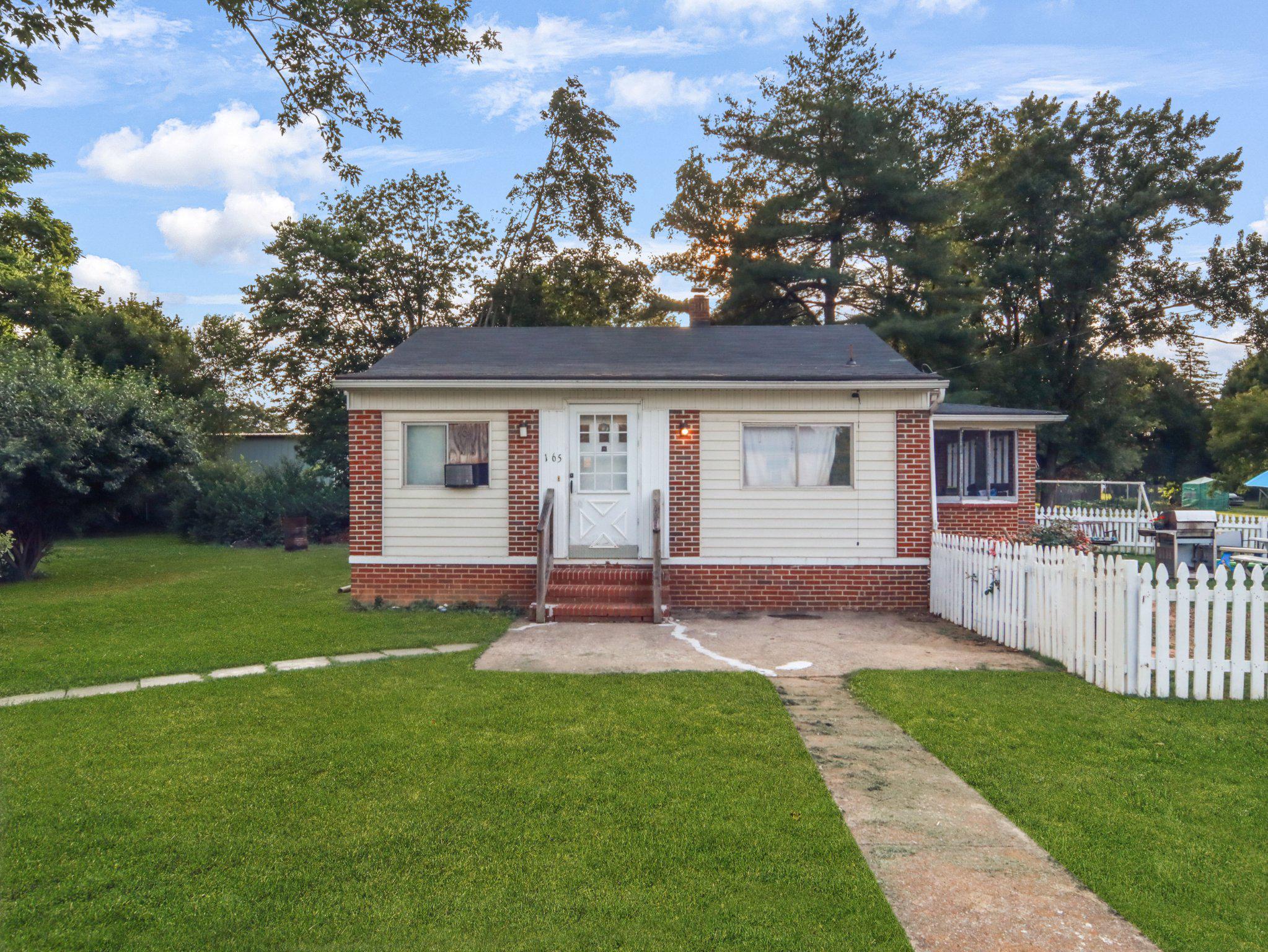 This charming 2-bedroom, 1-bathroom ranch-style home in Ashwood Lawns offers a perfect blend of comfort and functionality. Built in 1960, the property features durable brick and block construction, ensuring lasting quality. The full basement provides ample storage or potential for additional living space. The kitchen is equipped with essential appliances, electric stove, refrigerator, microwave, and an extra freezer, catering to all your culinary needs. The laminate flooring throughout adds a modern touch while being easy to maintain. Set on a very usable and manageable 0.23-acre lot, the property includes off-street parking with a gravel driveway and a shed for additional storage. This home is ideal for those seeking a cozy, well-equipped residence in a desirable neighborhood. Don't miss the opportunity to make this your own!