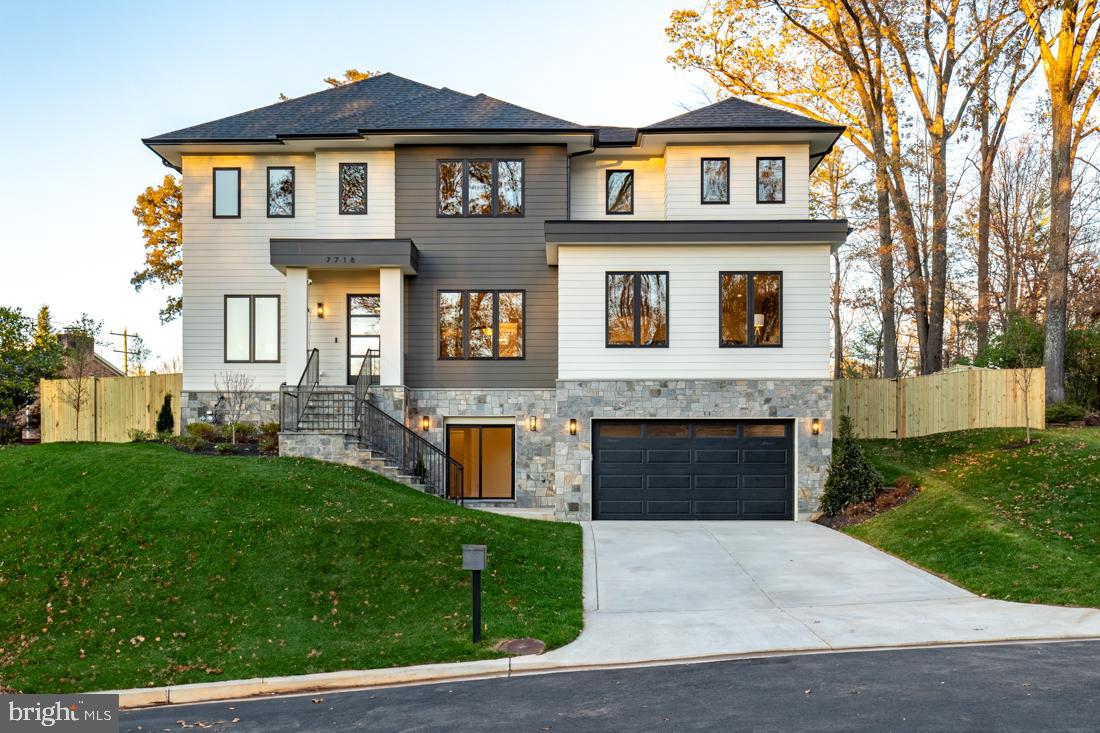 Spectacular sleek modern design home from Bella Home Construction.   7600 square feet.   Immediate delivery.  This gorgeous home has an open floor concept and boasts 6 bedrooms, 6 full bathrooms and 1 half baths.  7 1/2” European oak floors throughout all 3 levels.  Beautiful wood accent walls throughout the home.  This home has an elevator installed for your convenience.  10 ft ceilings on the main floor and 9 ft on the upper and lower levels.

On the main floor, you will be greeted by a formal living room, a full-sized dining room, a chef's kitchen, a family room complete with a gas fireplace, an additional private family room and a large main level bedroom guest suite.  The impressive kitchen is adorned with a large quartz island, quartz countertops and showcases top-of-the-line Jenn-Air stainless steel appliances and a butler’s pantry.  The outdoor space is equally enticing with expansive glass sliding doors and windows with natural sunlight granting access to a covered porch.

The upper level showcases 4 bedrooms, 4 bathrooms with a large laundry area.  The owner suite boasts a spa-like bath with heated floors, a spectacular 2-person rain shower, a free standing oversized 72” soaking tub, and a 2 large walk-in closet with custom cabinetry.

The lower level features a 4 tandem car oversized garage, a custom-built mud area, a gas fireplace in a spacious family room, wet bar with wine cooler, exercise room, bedroom and one full bathroom.