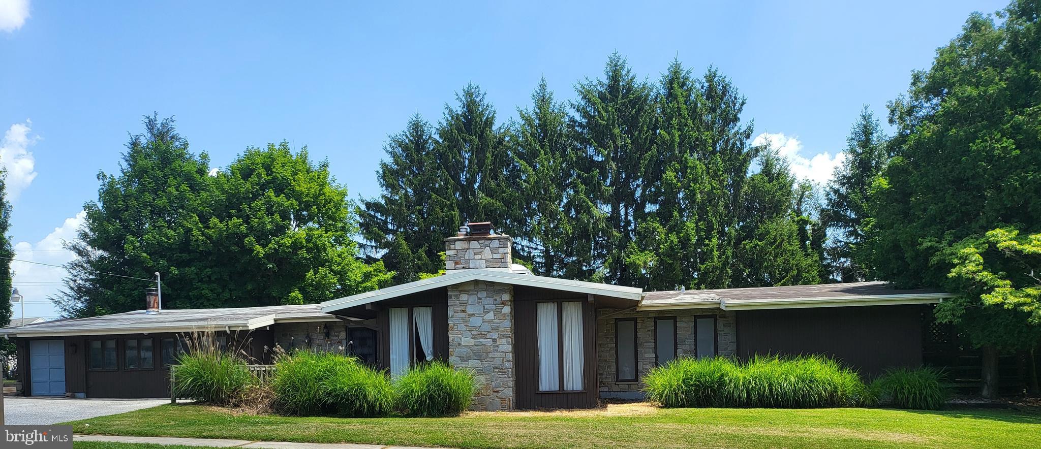 List price is Opening Bid at The Online Only Auction Sale to Be Held on The Auctioneers Website – Bidding begins Saturday, July 11th & ends Thursday, July 16th, 2026 at 11:00 AM. Sale includes 922 & 924 Academy Avenue. Discover a rare opportunity to own a distinctive Mid-Century Modern ranch home situated on two adjoining parcels totaling 0.46± acres in the desirable Owings Mills area. Offering timeless architectural appeal, exceptional character, and tremendous renovation potential, this one-of-a-kind property is ideal for homeowners, investors, or those seeking future development opportunities. The property also benefits from an approved two-lot minor subdivision, creating the potential for 2 single-family homesite. Designed to maximize natural light and seamlessly blend indoor and outdoor living, the home features a dramatic 8' x 10' skylight that fills the expansive great room with sunlight. Architectural highlights include three fireplaces, a luxurious sunken soaking tub in the primary bath,a library with extensive built-in shelving, and patio doors from nearly every room that open to the surrounding landscape. The main level offers approximately 2,761± square feet of above grade living space, including 4 spacious bedrooms, 3 full bathrooms, a large eat-in kitchen, and expansive sunken living and entertaining areas. The finished lower level provides additional flexible living space with a large recreation room, family room, utility room featuring 2 cedar closets, and abundant storage. Additional amenities include an extra-wide driveway with ample off-street parking and an extra-deep one-car garage, providing plenty of room for vehicles, hobbies, or workshop space. Ideally located just minutes from I-795, the Owings Mills Metro Station, Foundry Row, Mill Station, Stevenson University, shopping, dining, and major commuter routes, this property offers the perfect combination of privacy, convenience, and endless possibilities. Whether you choose to restore and celebrate its iconic Mid-Century Modern architecture, create your dream home through renovation, or capitalize on the approved subdivision and future building opportunity, this exceptional property represents a truly rare offering in one of Baltimore County's most desirable locations.