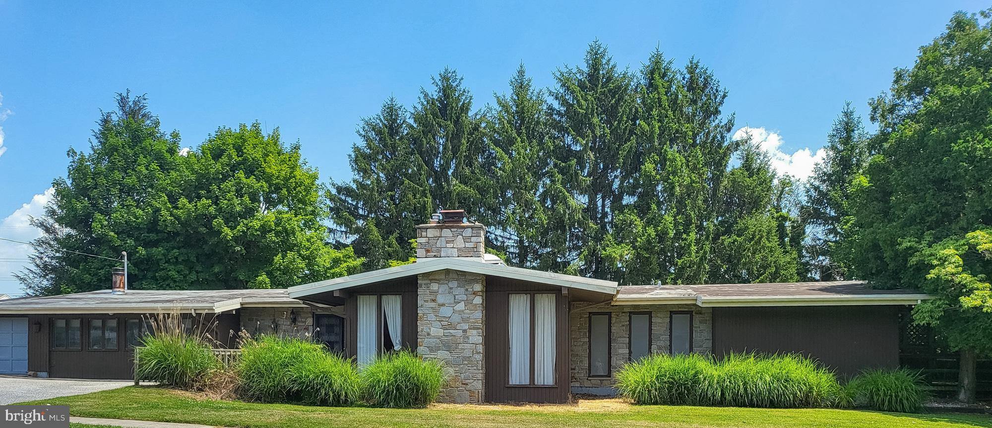 List price is Opening Bid at The Online Only Auction Sale to Be Held on The Auctioneers Website – Bidding begins Saturday, July 11th & ends Thursday, July 16th, 2026 at 11:00 AM. Sale includes 922 & 924 Academy Avenue. Discover a rare opportunity to own a distinctive Mid-Century Modern ranch home situated on two adjoining parcels totaling 0.46± acres in the desirable Owings Mills area. Offering timeless architectural appeal, exceptional character, and tremendous renovation potential, this one-of-a-kind property is ideal for homeowners, investors, or those seeking future development opportunities. The property also benefits from an approved two-lot minor subdivision, creating the potential for 2 single-family homesite. Designed to maximize natural light and seamlessly blend indoor and outdoor living, the home features a dramatic 8' x 10' skylight that fills the expansive great room with sunlight. Architectural highlights include three fireplaces, a luxurious sunken soaking tub in the primary bath,a library with extensive built-in shelving, and patio doors from nearly every room that open to the surrounding landscape. The main level offers approximately 2,761± square feet of above grade living space, including 4 spacious bedrooms, 3 full bathrooms, a large eat-in kitchen, and expansive sunken living and entertaining areas. The finished lower level provides additional flexible living space with a large recreation room, family room, utility room featuring 2 cedar closets, and abundant storage. Additional amenities include an extra-wide driveway with ample off-street parking and an extra-deep one-car garage, providing plenty of room for vehicles, hobbies, or workshop space. Ideally located just minutes from I-795, the Owings Mills Metro Station, Foundry Row, Mill Station, Stevenson University, shopping, dining, and major commuter routes, this property offers the perfect combination of privacy, convenience, and endless possibilities. Whether you choose to restore and celebrate its iconic Mid-Century Modern architecture, create your dream home through renovation, or capitalize on the approved subdivision and future building opportunity, this exceptional property represents a truly rare offering in one of Baltimore County's most desirable locations.