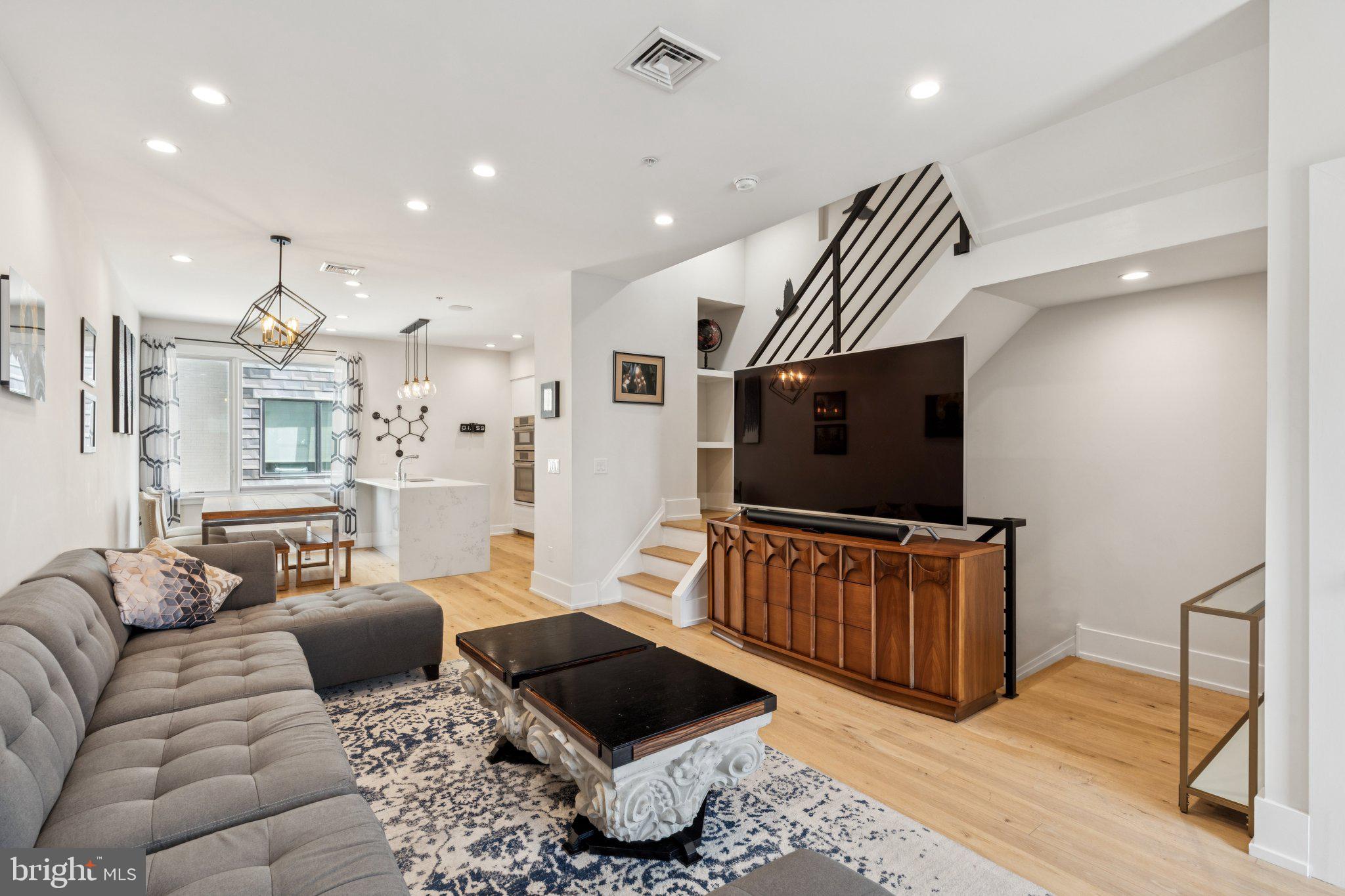Modern Elegance Meets Smart Urban Living in the Heart of Brewerytown!

This beautiful 4-bedroom, 4-bath (2 full, 2 half) residence offers luxury, comfort, and seamless connectivity in one of Philadelphia’s most vibrant neighborhoods. With hardwood floors throughout and an abundance of natural light, the home flows effortlessly from room to room, whether you’re entertaining guests or enjoying a quiet night in.

Main Floor.
The chef’s kitchen features sleek Porcelanosa cabinetry, a dramatic waterfall island, and top-tier Bosch appliances. Built-in overhead speakers on the main floor enhance the experience, whether you're hosting or relaxing.

Smart + Secure.
Equipped with a full Vivint security system (including front and backdoor cameras), Vivint smart thermostats, and a smart entry keypad, this home offers next-level peace of mind. Wired for Ethernet throughout, it’s ready for remote work or smart home expansion.

Private Outdoor Living.
The expansive roof deck offers panoramic sunrise, sunset, and downtown views. Organized to have separate dining and lounge areas, and built-in outdoor speakers, its an entertainer’s dream. A wet bar with refrigerator, dishwasher, and sink on the third floor makes rooftop hosting effortless.

Bedrooms + Baths.
The large primary suite features a spa-like bathroom with a Kohler smart toilet, digital steam shower with multi-function fixtures including a rain head, handheld wand, and back jets. A custom California Closets walk-in completes the suite. Two additional bedrooms with walk-ins share a full bath on the second floor, alongside a convenient laundry room with high-efficiency Samsung washer and dryer. The fourth bedroom doubles perfectly as a home office or nursery, also with a large closet.

Extras You’ll Love: Gated driveway with secure two-car parking, garage keypad + smart backdoor entry, built-in HVAC humidifier + tankless water heater, approximately 3 years remaining on a full (not graduated) property tax abatement

Unbeatable Location. Just three doors from Together Skateboarding & Coffee, Brewerytown’s informal community hub, and walking distance to the Art Museum, Schuylkill River Trail, and top local favorites like Human Robot Taproom, New June Bakery, Baby’s Kusina, and more.