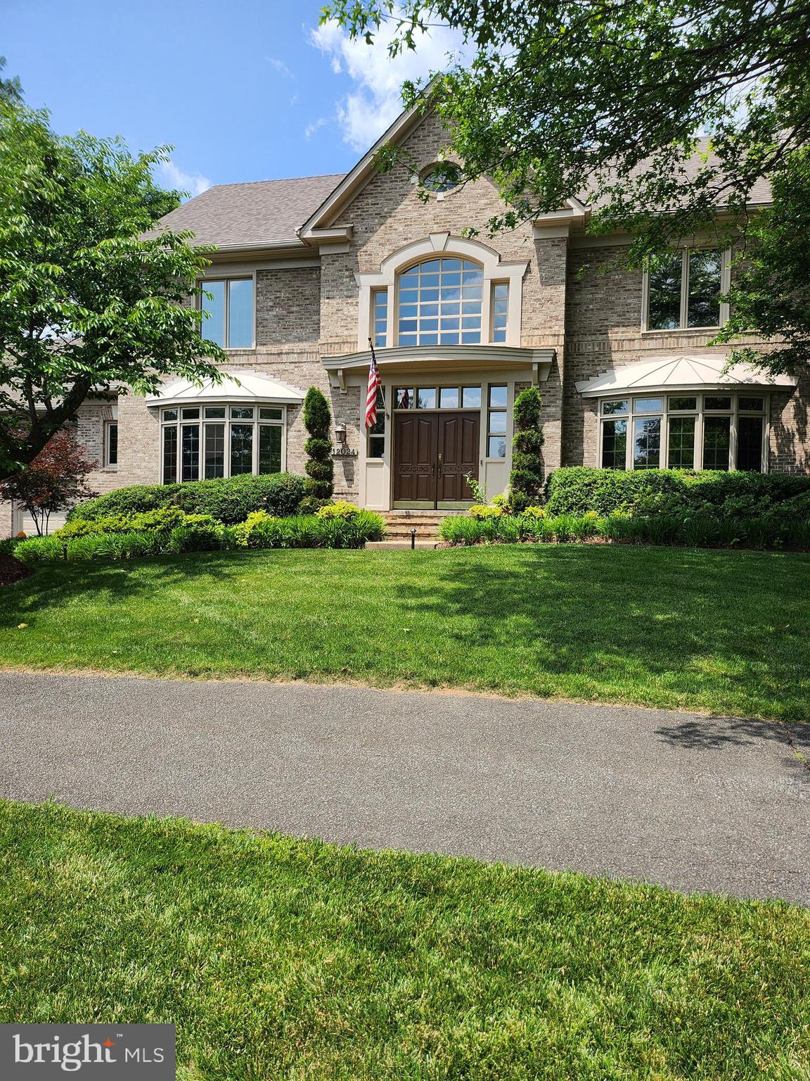 Stunning Luxury Living in Prime Reston Location! 
Welcome to this breathtaking 6-bedroom, 4.5-bath Gulick home in one of Reston’s most desirable neighborhoods, boasting over $200,000 in updates. From the moment you step into the dramatic two-story foyer with a curved staircase, this home radiates elegance and sophistication.
The formal dining room is perfect for hosting gatherings, and both the dining and living rooms feature wall-to-wall and floor-to-ceiling bay windows, allowing natural light to flood the home. The formal living room also includes a wood-burning fireplace with a custom mantel surround. Hardwood floors flow throughout the main level, which also includes a large office with solid wood maple built-in cabinetry. The main level is equipped with built-in surround sound speakers, ensuring exceptional sound quality for entertaining or everyday living.
At the heart of the home is an expansive gourmet kitchen designed for both beauty and functionality. It features upscale appliances, including a Wolf 6-burner cooktop seamlessly integrated into the island, a Sub-Zero side-by-side refrigerator/freezer, a Bosch dishwasher, a built-in wine refrigerator, and quartz countertops. The white cabinets are complemented by ambient above-cabinet and under-counter lighting, creating a warm and inviting atmosphere. The butler’s pantry, currently styled as a coffee bar, adds convenience and charm, while a separate built-in bar area enhances the kitchen’s entertaining capabilities. Adjacent to the kitchen is a spacious family room anchored by a gas fireplace with a wood and marble surround, offering a welcoming space to gather and relax.
The eat-in kitchen area opens to a composite trex deck with built-in lighting, perfect for outdoor dining and entertaining. The backyard is a private oasis, complete with professional perimeter lighting that transforms the space into a magical retreat in the evenings.
Upstairs, the luxurious primary suite is a true sanctuary, featuring vaulted ceilings, an incredibly spacious walk-in closet, two additional closets, and a cozy gas fireplace. The spa-like primary bath includes a frameless glass shower, a clawfoot soaking tub, and heated floors for ultimate comfort. Three additional bedrooms complete the upper level, including a Jack-and-Jill suite and a bedroom with its own private bath.  All 5 bathrooms within the home have been updated within last 5-10 years.
The walkout lower level offers incredible versatility, featuring two additional bedrooms, a large family room with built-in espresso bar cabinets, 2 beverage refrigerators, and an updated full bathroom with a frameless shower and rainforest showerhead. The wide-plank luxury vinyl flooring adds a sleek and modern touch, while abundant storage space provides endless possibilities for a media room, wine cellar, or gym. Updates of all major systems and NEW ROOF 2020!  
This home’s location is unmatched. Just one mile from Reston Town Center, you’ll enjoy premier dining, shopping, and entertainment. The Silver Line Metro station is also a little over a mile away, making commuting or city adventures effortless.
Schedule your private tour today and experience the perfect blend of luxury, location, and lifestyle.