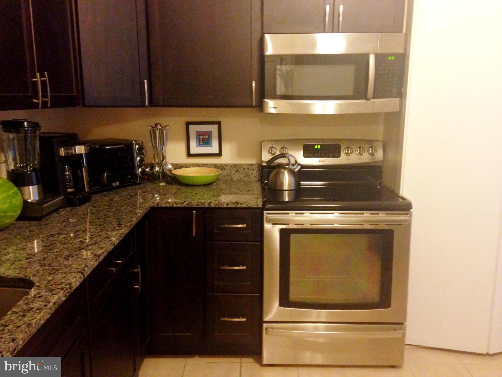 Just Reduced. Nestled On a Quiet Lower Level, This Gorgeous 2 Bedroom, 2 Baths Home Has The Feel of A Retreat to Escape From Your Busy Day. Just Footsteps From the Swimming Pool, Yet Tranquil. Rear Porch Backs to Open Common Area.  Featuring Fully Renovated Kitchen w/Stainless Steel App and Granite Countertops, Walk in Closets.Gas Included in fees. Maintenance Free Condo. **No Pets Allowed.