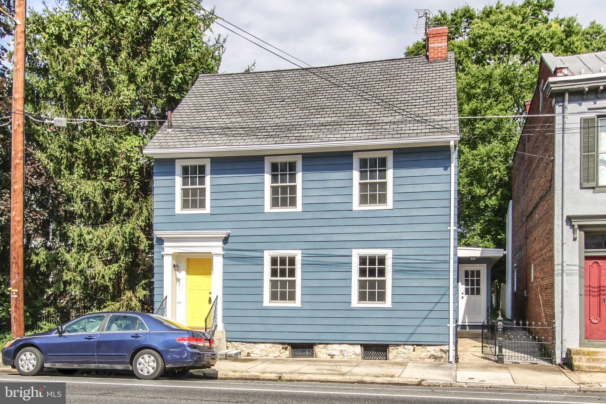 Live spaciously in the historic area of Carlisle. This newly-renovated 4 bedroom, 2.5 bathrooms has everything you want! The stunning foyer will greet you first walk in the door. The tile flooring and the shiplap coat area will give this historic home the modern flair. Then you will be greeted by the living room which includes a gas fireplace for those chilly evenings. Walk through the archway into the formal dining room that has an incredible light fixture that adds so much charm to the room. The dining room is large enough for those extra special gatherings. Next is the immaculate kitchen From the 10 foot island to the sparkling quartz countertops to the stainless steel appliances to the beautiful backsplash. This kitchen truly is the best of the best. From the kitchen you will walk down into the family room. This living space is very cozy. Upstairs you will find the luxurious master suite, with a newly renovated bathroom featuring a gorgeous tile shower with a glass door. There are two additional spacious bedrooms and a second full bathroom upstairs. As an extra special bonus to this already fabulous home, there is a laundry area on the second floor. We are not done yet. The 3rd floor not just finished, but it is heated and cooled and has an extra-large closet, making it a 4th bedroom. Hardwood floors, soft close cabinets, modern light fixtures, brand new half bathroom, full basement, new plush carpet, modern style tile flooring. You will enjoy the large covered rear patio with plenty of room for summer barbecues and a quiet cup of coffee year-round. The detached 3 garage is HUGE and has a brand new concrete floor. Located within blocks of local history, Carlisles best coffee shops and restaurants ... and just a short walk to the YMCA.  Enjoy the best of Carlisle living from this centrally located home with all the amenities you want!