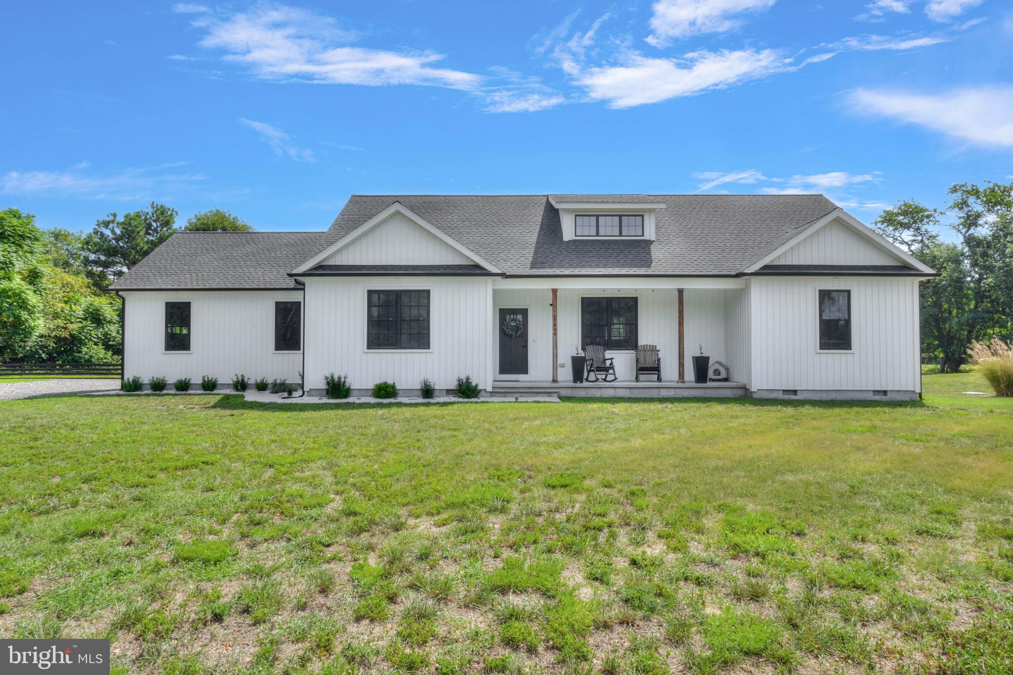Welcome to 17444 Niblett Ln, where modern style meets peaceful country living. Tucked away down a private lane, this beautifully maintained single-level home offers 3 bedrooms, 2 bathrooms, and an inviting open-concept design filled with natural light. Soaring ceilings create a spacious feel throughout the main living area, while the living room features a cozy fireplace and ceiling fan, seamlessly flowing into the stylish kitchen with stainless steel appliances, a center island with bar seating, and ample space for entertaining.

Enjoy year-round relaxation in the sunroom overlooking the backyard, or retreat to the private primary suite complete with a walk-in closet and an ensuite bath featuring a walk-in stall shower. Outside, the fenced backyard is designed for both entertaining and everyday enjoyment with a rear deck, patio, and charming pergola, while the side-entry garage adds convenience and curb appeal.

Ideally located just minutes from Seaford's shopping, dining, schools, and parks, this home also offers easy access to Hooper's Landing Golf Course, Woodland Ferry and Wharf, and the scenic Nanticoke River. Combining modern finishes, thoughtful design, and a tranquil setting, this move-in-ready home is one you won't want to miss.
