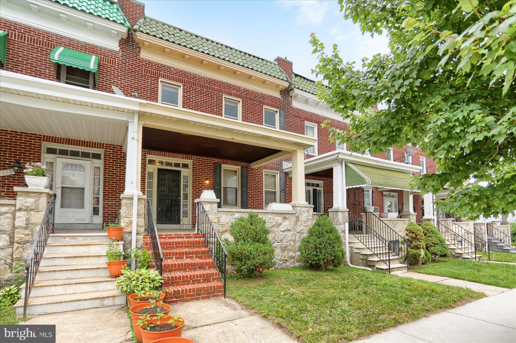 2417 N Pulaski Street: Space, Character, and a Real Foothold in Baltimore
Some homes check a box or two. This one checks all of them.

Built in 1920 and tucked into the Whittier-Monroe neighborhood, this classic Baltimore brick rowhome delivers over 2,500 square feet of living space - a rare find at this price point in the city. Four generous bedrooms, a cozy fireplace, and hardwood floors with rich mahogany inlay give the home a warmth and substance that newer construction simply can't replicate. Energy-efficient windows keep things comfortable year-round without sacrificing the original character that makes a home like this worth buying.

The kitchen is built for real life - granite countertops, a center island, and included appliances make it equally suited to a quick weeknight dinner or a full spread for company. The partially finished basement with its own rear entrance opens up your options: home office, gym, playroom, media room - the space is there, ready to become whatever you need it to be.

Out front, the classic covered porch is exactly what a Baltimore morning calls for.

The location is the biggest selling point. Druid Hill Park and the Maryland Zoo are minutes away. So are the Inner Harbor, downtown, Hopkins, and UMMC. Grocery stores, restaurants, coffee shops, parks, and transit are all within easy reach - you get the full energy of city living without fighting for it. The Whittier-Monroe community adds to that with genuine neighborhood pride: block parties, community events, and an active neighborhood watch that makes the area feel looked after.

As an interior rowhome, ongoing maintenance stays manageable - more time living, less time maintaining.

For first-time buyers especially, this is the kind of opportunity that's getting harder to find: real square footage, real character, real city convenience, at a price that makes ownership feel achievable. Plus, this property qualifies for Healthy Neighborhood Grants! 2417 N Pulaski isn't a compromise - it's an upgrade.
