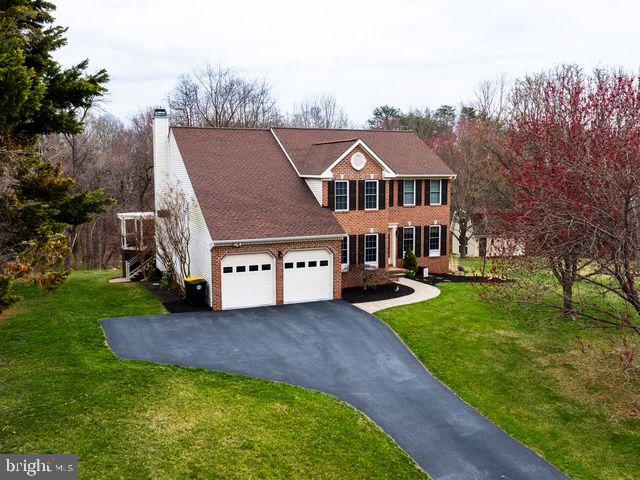 ALL OFFERS DUE SUNDAY 4/6 BY 10PM! Have you been waiting for that perfect home that takes your breath away on the inside, and is an amazing oasis on the outside!? Look no further! This stunning colonial features over 3300  square feet of finished space, 4 bedrooms, 3 full baths and 1 half bath, and sits on 1.5 acres (on a cul-de-sac) that backs to woods and a stream!  It is Nirvana! Come inside to be greeted by the large open foyer and beautiful LVP planking throughout most of the main level.  The large, fully updated kitchen features granite counters, backsplash, inset sink, stainless steel appliances, five-burner gas stove, upper and lower oven (all in one), and a beautiful island as the centerpiece! There is also an eat-in table space. The open concept flows directly into the family room which features a floor-to-ceiling window that allows you to enjoy the incredible view. This room is anchored by the gas fireplace for those cozy nights! The large formal dining room and family room have plenty of room for the whole family to gather! There is also a sizable main-level office and laundry room to round out the first floor. Head upstairs, where you will find brand-new carpet throughout all four bedrooms. The primary bedroom is oversized and features two skylights, a large walk-in closet with organizers, and a large primary bath, boasting dual vanities, a soaking tub, and a separate shower.  The other three large bedrooms are served by a fully updated, gorgeous hall bath. The finished basement features a main section where the family can get together for the big game, with a wet bar, and a tiled floor  
near the walkout slider for when the kids come in from exploring the woods! This room is served by an updated full bath! There’s also a large work room and storage area. This basement has it all! But we haven’t even gotten to the best part. The outside is an amazing oasis! The very large composite deck with a circled area in one corner is a beautiful place to enjoy your morning coffee or afternoon beverage. The outside steps lead down to a poured concrete patio and stunning Koi pond with a waterfall that brings the perfect relaxation to the end of any day. This truly is magical!  The 1.5 acres include a big side yard for your  kids to play any sport their heart desires! There is also a two-story shed with electric, perfect to store all your outdoor gear or have your own shop, and then a 2 car attached garage with extra storage space! All this and you are within walking distance (on a paved trail with exercise stations!) to beautiful downtown Sykesville, which has been voted the coolest small town in America!  This Home has it all! Check out this list of upgrades: New carpet (2025), water heater (2023), disposal (2023), sump pump (2023), kitchen remodel (2022), first floor LVP (2022), Soffit, fascia, downspouts, gutters, and shutters (2022), hall bath full renovation (2022), new windows and patio doors (2016), deck (2013), architectural shingle roof (2010). Within minutes to both Rte 32 and 97! This is truly a "must-see"!