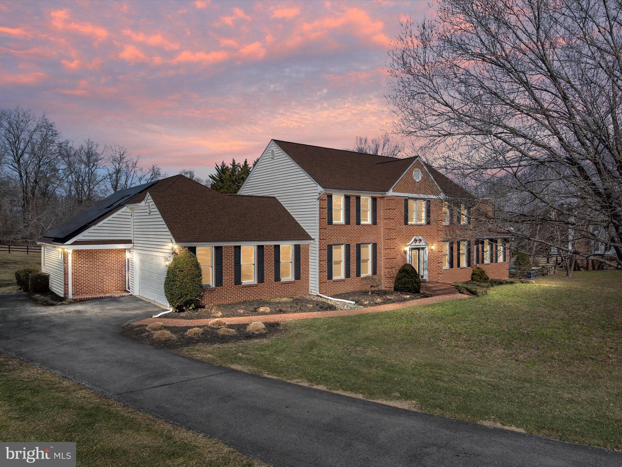 Welcome to the enclave at Windsor Farm! A picturesque estate on a beautifully landscaped 2 acres nestled amongst the backdrop of sprawling green pastures, this home offers an unparalleled sense of privacy while remaining perfectly suited for entertaining and multi-generational living! The custom-built in-law apartment is a rare gem, seamlessly integrated with the main home yet designed to provide complete privacy and independence. Every detail has been thoughtfully curated to create a retreat that exudes both comfort and elegance. Vaulted ceilings soar above, enhancing the sense of spaciousness, while oversized windows frame breathtaking pastoral views, filling the home with an abundance of natural light and a serene ambiance. The gleaming hardwood flooring stretches throughout, adding warmth and character to the inviting space. The spa-inspired bathroom offers a luxurious escape, where sleek finishes and soothing design elements create the perfect place to unwind. The three-season sunroom becomes a haven of relaxation, with multiple glass sliding doors that seamlessly blend indoor and outdoor living. Whether enjoying a morning coffee as the sun rises or winding down in the evening with a book, this sunlit space provides a peaceful retreat in every season. With its own entrance, this home within a home, ensures complete autonomy while maintaining a connection to the main residence. A dedicated washer and dryer adds to everyday conveniences, while an attached lower-level garage provides ample storage, ensuring that everything has its place. Perfectly suited for multi-generational living or as an upscale guest suite, this in-law apartment is a harmonious blend of style and function. Rich hardwood flooring greets you as you step inside the main home's grand foyer entry, complementing the abundance of natural light streaming through the abundant windows throughout. A gourmet kitchen, designed with both elegance and functionality in mind, serves as the heart of the home, boasting stainless appliances, double wall ovens, extensive counter space, an oversized window at the sink to take in the backyard views and a welcoming family dining area that invites conversation and connection for everyone. Just beyond is the inviting family living space centered around a crackling gas fireplace, offering a cozy den on cool evenings with access out onto the screened back porch where you can unwind and relax overlooking your own backyard oasis. Enjoy the best of indoor-outdoor living with this home’s multiple decks and patios, creating an ideal setting for entertaining or unwinding in the fresh air any time of the year! The newly updated saltwater swimming pool shimmers under the sun, promising endless relaxation and fun while overlooking breathtaking views of the lush landscape. The upper level offers four spacious bedrooms, including the primary en suite with a fully renovated bathroom, vaulted ceiling and walk-in closet. The fully finished basement, with on-grade exterior access extends the home's living space, offering a versatile area for additional recreation, the 5th bedroom with Murphy Bed, a guest bathroom perfect for those pool parties and family gatherings, and a dedicated home gym and sauna provides a convenient wellness retreat for the entire family. Tucked away in an idyllic country setting, this home offers a unique opportunity to enjoy the best of both worlds in an exquisite, peaceful setting, yet still conveniently close to major routes with easy access to Annapolis, Washington, D.C., and Baltimore, offering the best of both worlds. Come make this your new home and let the adventure begin!