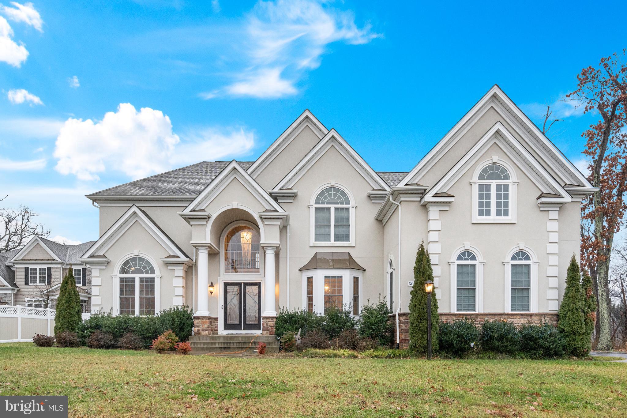 Indulge in the epitome of luxury with this gorgeous 5-bedroom, 4.5-bath colonial, where sophistication meets functionality. The open floor plan gracefully unfolds, highlighted by a grand two-story foyer, setting the tone for a home of distinction. The expansive kitchen, adorned with stainless steel appliances and a gas cooking range, showcases a large center island and a sunlit breakfast nook. A two-story living room captivates with its grandeur, while a formal dining room adjacent to the kitchen provides an elegant setting for gatherings. Adding versatility to the main level, a bonus room awaits—perfect for a home office or a cozy retreat. Ascend the staircase to discover four bedrooms, including a primary suite that redefines opulence. The primary bedroom features a palatial full bathroom, complete with a walk-in shower, a soothing soaking tub, and dual counters. The second bedroom upstairs boasts its attached full bathroom for added convenience. The basement unveils an entertainer's dream, offering an additional bedroom with an adjacent full bathroom—an ideal guest suite. Step outside to the backyard, where a spacious patio and a fenced-in yard create a private haven for relaxation. Practicality meets convenience with the two-car garage, completing this exceptional residence. Experience the perfect blend of elegance and comfort in this stately colonial—a home meticulously designed to fulfill every desire for refined living.