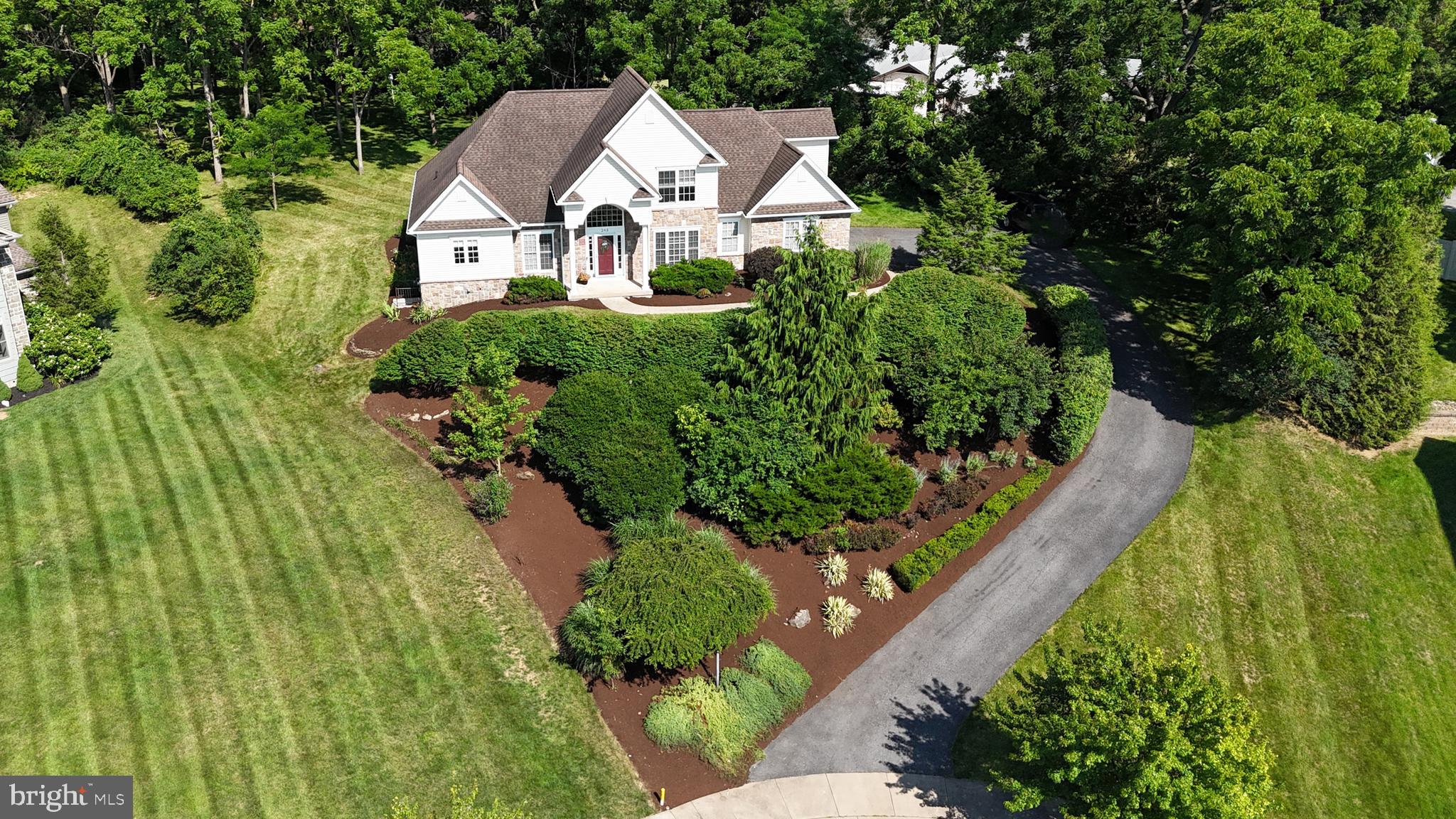 OPEN HOUSE - Sunday, July 26th, 11:30 AM - 1:30 PM
This architect-designed, custom-built two-story home offers stunning views in the highly sought-after Stearns Crossing neighborhood of State College. Featuring four bedrooms and three and a half baths, it sits on a beautiful 0.8-acre lot at the end of a quiet cul-de-sac. The open floor plan welcomes you with a grand two-story foyer, 9-foot ceilings in the formal dining and living rooms, and cathedral ceilings in the family room with a cozy gas fireplace. The family room flows into a gourmet kitchen with abundant white cabinetry, granite countertops, and a charming breakfast area. French doors lead to a spacious patio and a private, flat backyard perfect for entertaining. The first-floor owner’s suite features two closets, a double sink vanity with a makeup table, a Jacuzzi tub, and a separate shower. Upstairs, you’ll find three bedrooms, a loft, and a full bath. Hardwood floors enhance the main level and loft, while large windows and transoms fill the home with natural light. A finished walkout basement of approximately 1,000 square feet, complete with a third full bath, offers additional living space. Enjoy breathtaking sunsets and sweeping views of Beaver Stadium and downtown State College, all surrounded by professional landscaping.