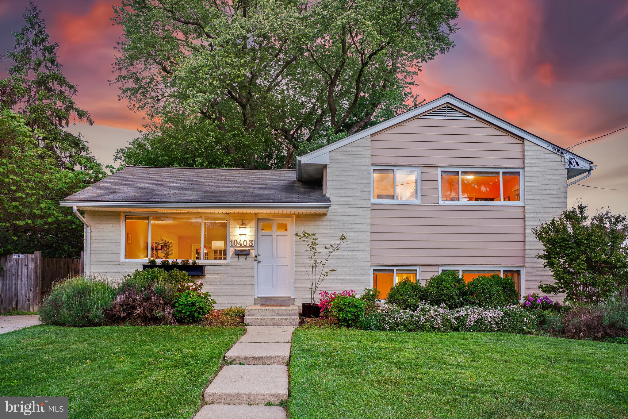 Welcome to this beautifully updated midcentury home in the sought-after Carroll Knolls neighborhood. The main level features an open-concept layout with a bright living room and adjoining dining area, both with wood floors. The renovated kitchen boasts a large peninsula, granite countertops, stainless steel appliances, handsome cabinetry, decorative wood slat wall, and a subway tile backsplash. A set of French doors off the dining room leads to a tranquil wood deck with a pergola, perfect for relaxing or entertaining. All nestled on a quiet side street, yet just minutes from Forest Glen Metro, Capitol View-Homewood Park, and numerous local amenities. This deceptively spacious home offers sun-filled interiors, charming outdoor spaces, and thoughtful updates throughout.

Upstairs, you’ll find three bright bedrooms, all with hardwood flooring and overhead lighting. The primary suite includes two closets and a stylish renovated private bath featuring pebble stone flooring. A second updated full bath with modern glass tile accents serves the additional bedrooms. The upper level also features wood floors throughout, adding to the home’s warmth and continuity.

The lower level provides even more living space with a bright, spacious family room showcasing tile flooring and two walls of windows that bring in natural light. Just down the hall is a fourth bedroom or ideal home office, a half bathroom, and laundry.

The private driveway offers easy off-street parking, while a storage shed adds extra functionality. The mature landscaping, including colorful plantings throughout the front and backyard, creates a peaceful outdoor setting with curb appeal. Enjoy being just a block and a short trail walk from Capitol View-Homewood Park and Homewood Dog Park, as well as steps to Oakland Terrace Elementary (home of a Spanish immersion program), Glenwood Pool, and several other parks. You're also just over a mile to Wheaton Metro and Westfield Mall, with numerous stores, restaurants, health clubs, and theaters nearby.
With easy access to the Beltway, downtown Silver Spring, and major commuter routes, this home offers the perfect blend of location, comfort, and space in one of Silver Spring’s most desirable neighborhoods.