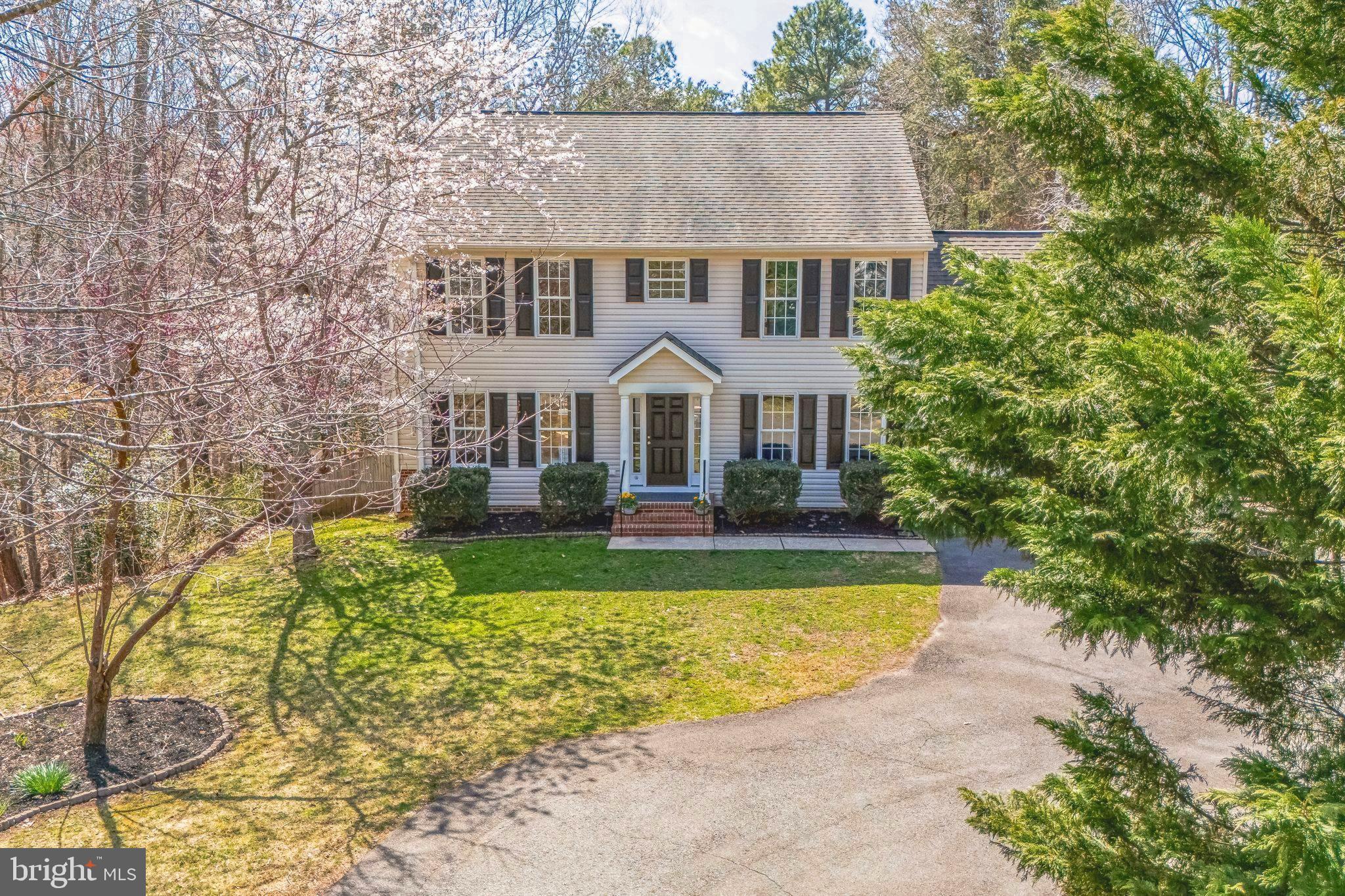 Welcome to the stunning South Woods community! This lovely 4/5-bedroom, 3.5-bathroom home spans 3004 sf. With an attached garage, a paved driveway, and a fantastic layout, this home offers ample space. Step inside to an open-concept design with a bright kitchen, eat-in area with custom built-ins, and inviting living spaces. The main level features a cozy gas fireplace in the living room, a large dining room, and an adaptable playroom/family room. The beautiful updated kitchen boasts granite countertops and newer appliances, a spacious built-in breakfast nook with storage benches, and a conveniently situated laundry room. The upper level features a primary suite with a cathedral ceiling, his-and-hers closets, and a luxurious ensuite bath with a new granite dual vanity and Jacuzzi tub. You'll also find three sunny bedrooms with a dedicated full bath. The versatile finished walkout basement offers bamboo flooring throughout, a guest bedroom/bonus room with an additional full bath, large open Exercise and Game rooms, and a spacious storage room with built in shelves. Enjoy serene views from the fenced backyard, as you step onto the expansive composite deck (2022) or relax on the gorgeous hardscape patio with a Plantation 60 cast iron firepit, built-in seating, and automated lighting (2019). Perfect for entertaining or unwinding in peace!

This home is equipped for modern living with a 2023 HVAC system featuring high-efficiency Carrier system with humidifier (recently serviced), whole-home wiring for ethernet, cable, and security system (not currently set up with a provider), Ecobee Smart thermostats with 6 sensors for precise temperature control. All newer kitchen appliances are included, and the seller’s active pest control service contract can be transferred to the new owner for added peace of mind.

The community offers a saltwater pool, tennis and basketball courts, playgrounds, and a clubhouse available for free reservations—perfect for hosting events or gatherings.

Location is everything! Just 15 minutes from restaurants, shopping, and fitness centers, and only 10 minutes from I-95 and the VRE, this home offers the perfect blend of tranquility and convenience.

Imagine cozy evenings by the fireplace, summer barbecues on your expansive deck, and unwinding on the patio as you take in the tranquility. Homes in this sought-after community don’t last long - Schedule your private tour today!