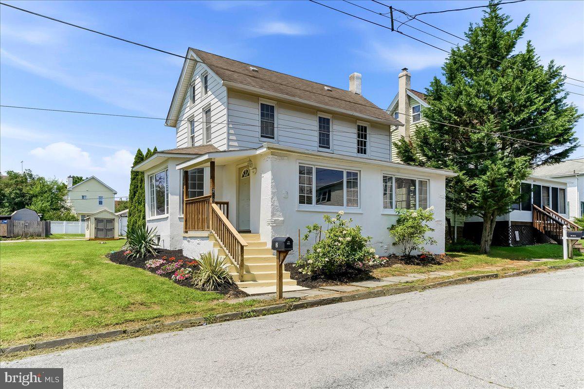 This colonial home, on a large .32-acre borough lot, features an amazing remodeled rear deck, off-street parking and lots of updates. The heated sunroom, with large picture windows, has new laminate flooring and laundry hookups to make your chores easier. Kitchen has new countertops, numerous cabinets and a gas stove for serious chefs. Generous sized living room, with a lovely historic walk- in bay window, has new floors and large windows to flood the room with light. Eating areas, with easy access to the kitchen, could be created in the sunroom or the corner of the living room. Upstairs you will find bedrooms with new paint and floors as well as a bathroom with numerous updates. Pulldown stairs, to a large, floored attic, is the perfect storage area (sky basement anyone?) Add a newer high efficiency gas heater with central air, newly painted interior and a large level yard with a storage shed that is ready for your gardening tools, and you will be ready to call this home.