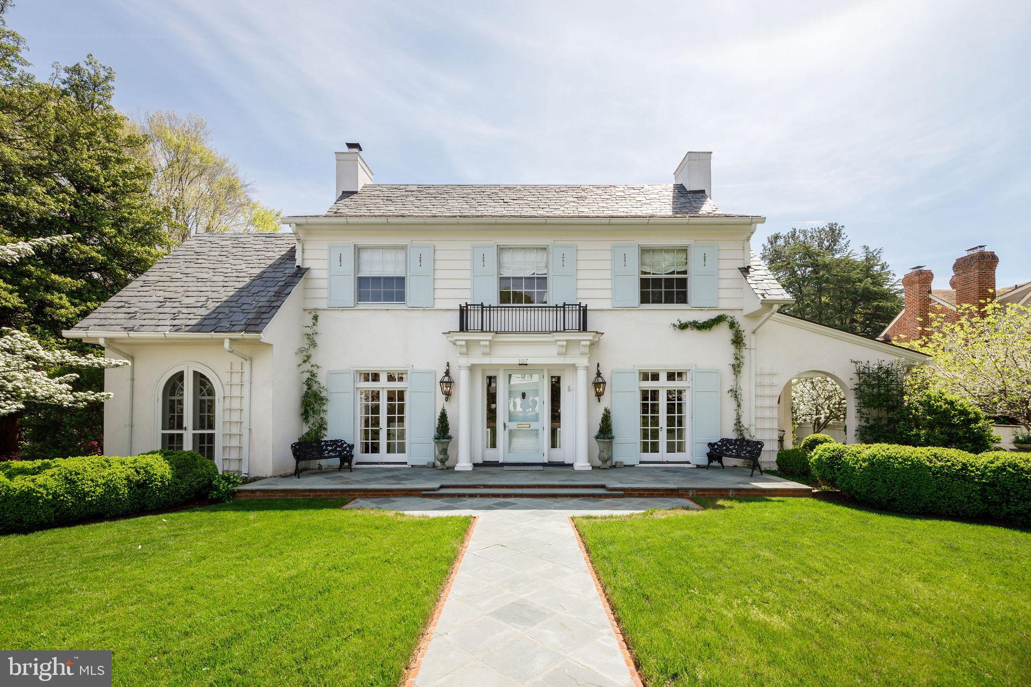 Built in 1922, 307 Oak Lane is a rare architectural treasure designed by Carl Lindner, Sr. and is the second home constructed in Hampton Gardens. Rich in history and character, this distinguished residence blends timeless craftsmanship with thoughtful modern updates. Featured on the 2021 Historic Garden Week Tour, other notable moments in the home’s past include violinist Isaac Stern performing in the living room as a guest of a former Richmond Symphony Foundation chair, and a crape myrtle in the rear garden gifted to previous owners by The White House during the Truman era. ***This beautiful home offers four bedrooms, three full baths, one half bath and features 10-foot ceilings, transomed doors, two indoor fireplaces, and a Buckingham slate roof in a rare irregular pattern favored by Lindner. Elegant details include a geometric diamond design in the front hall floor and Italian stucco walls in the sunroom, both by decorative painter Anne Thompson. A significant 2013 renovation by architect Charles Aquino and builder Chip Spitzer expanded the home to include a new primary suite, a second-floor laundry room, and a new open-concept kitchen and family room addition at the rear of the home, seamlessly integrating modern comforts while preserving the home’s historic integrity. ***The property's professionally designed grounds and outdoor living spaces are a stunning backdrop for hosting family and friends. French doors from all main-level rooms open to terraces, including the family room’s access to the covered bluestone porch, creating seamless indoor-outdoor flow. Built in 2018 by Gardner Construction, the porch features a wood burning fireplace, television, fans, and sound system - perfect for year-round entertainment. Additional features include a courtyard with water feature (masonry by David Aldrige and Craddock Masonry), fenced kitchen and herb garden, original entrance columns repurposed as garden focal points, custom copper outdoor lanterns by Carolina Lanterns, a 19’ x 14’ shed with French doors, a Richmond granite cobblestone-edged driveway that can accommodate three cars, and a bluestone walkway bordered by original brick. This is a truly special offering - where architectural pedigree, historic provenance, and modern livability come together in one extraordinary home.