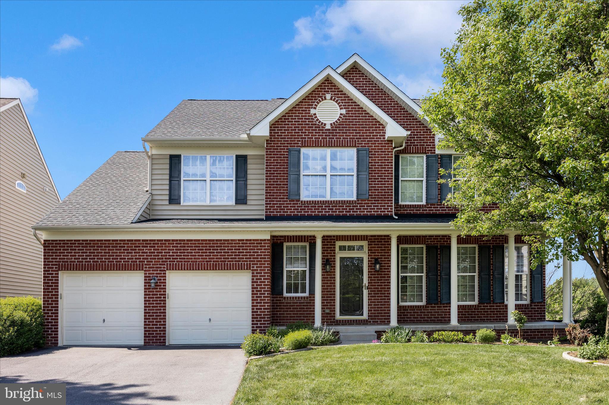 This beautifully maintained, mostly brick-front colonial welcomes you with a charming front porch and an ideal setting next to open green space—meaning you can enjoy extra privacy with only one neighboring home. Inside, the entire main level boasts gleaming hardwood floors and a spacious, well-designed layout. You'll find a formal living room, dining room, and a cozy family room with a gas fireplace that opens to the gourmet kitchen. The bright sun/breakfast room just off the kitchen floods the space with natural light and provides direct access to the maintenance-free deck—perfect for morning coffee or evening relaxation. A convenient laundry room sits right off the garage.  Upstairs, hardwood stairs lead you to the spacious owner’s suite complete with a sitting area, walk-in closet, and a luxury bath showcasing a beautifully tiled shower, soaking tub, and double vanities. Three additional bedrooms share a well-appointed hall bath.
The lower level offers a rough-in for a full bath and outside access—ready for you to customize and finish to suit your needs.  Packed with valuable updates, this home features a 6-year-old roof, a 3-month-old HVAC system (both furnace and outdoor unit), an electric car charger in the garage, a battery backup for the sump pump, and a freshly painted garage floor. A security system adds extra peace of mind.  Residents of Clover Ridge enjoy fantastic community amenities, including an outdoor swimming pool, walking paths and tot lots.  Conveniently located close to grocery stores, dining, commuter routes, and more, this home offers the perfect blend of comfort and convenience.  Schedule your showing today before someone else has the chance to call it home!