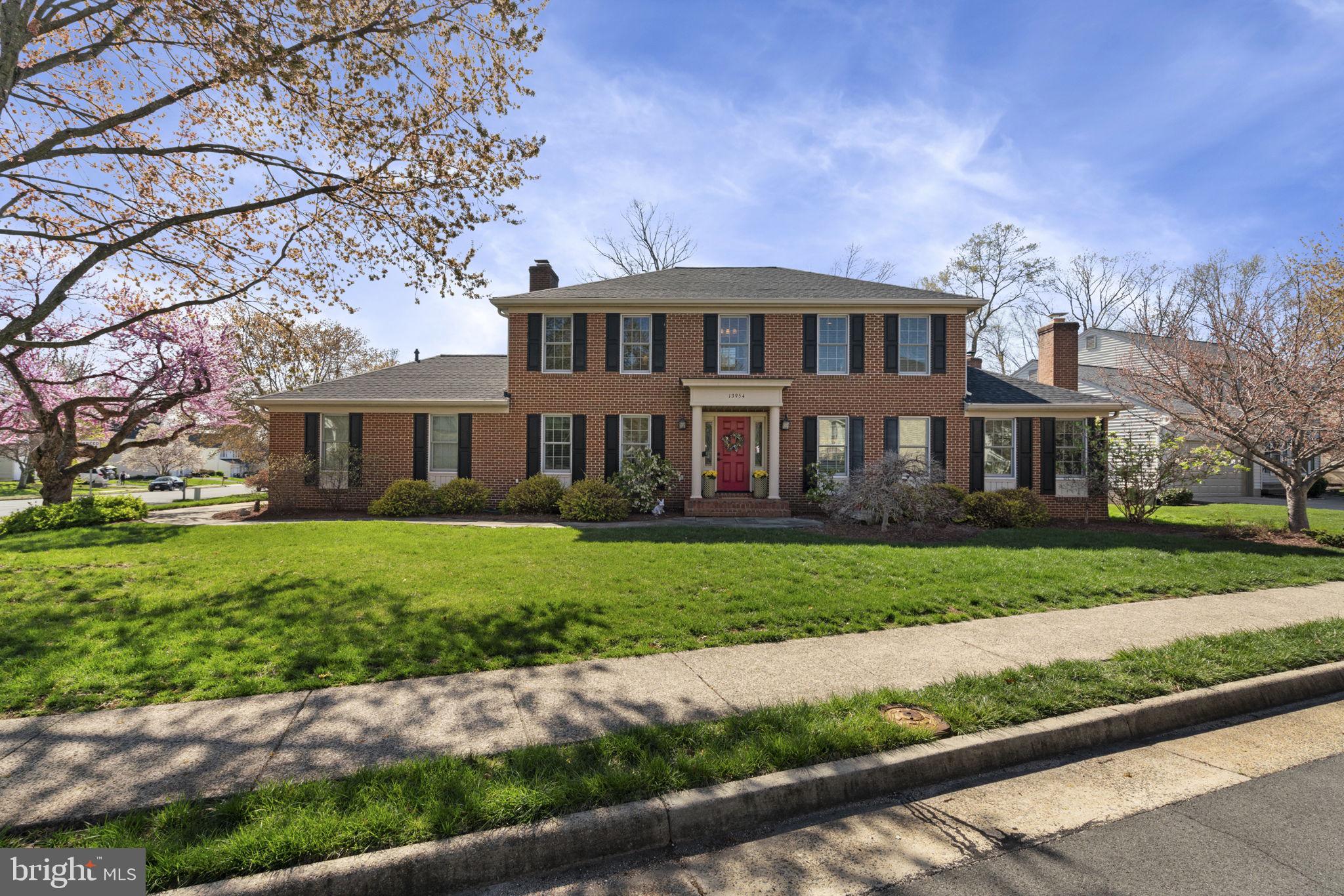 OFFERS DUE TO LISTING AGENT BY 3PM MONDAY 4/7 Nestled in the highly sought-after Little Rocky Run community of Clifton, Virginia, this stately brick-front colonial commands attention on a beautifully landscaped corner lot. Impeccably maintained and thoughtfully updated, this home offers a seamless blend of classic elegance and modern sophistication, making it a truly exceptional property.

The main level boasts exquisite engineered hardwood flooring, accentuated by crown and chair rail molding that adds a timeless touch. A distinguished private library with custom built-ins, French doors, and a fireplace provides a refined space for work or relaxation. Enjoy hosting special occasions in the elegant formal living and dining rooms, perfect for holidays and gatherings with family and friends. The inviting family room, also featuring a fireplace, flows effortlessly into the gourmet kitchen, where top-of-the-line stainless steel appliances, gas cooking, a spacious center island, custom cabinetry, and a pantry cabinet create the perfect culinary setting. A well-appointed laundry room on the main level adds to the home’s convenience.

Designed for year-round enjoyment, the magnificent screened porch—renovated in 2023—features skylights that bathe the space in natural light, offering a serene retreat and an incredible space to take in some fresh air.

The upper level is home to the luxurious primary suite, where a spacious bedroom, a custom-designed walk-in closet, and a spa-like en-suite bath create an atmosphere of indulgence. The primary bath is beautifully appointed with a frameless walk-in shower and an oversized jetted soaking tub. Three generously sized secondary bedrooms provide ample accommodations for family or guests.

The fully renovated lower level is designed for versatility and entertainment, featuring a sprawling recreation room with premium LVP flooring. A huge, spa-inspired full bath includes a second jetted soaking tub and a walk-in shower, while an expansive unfinished storage area offers endless possibilities. The basement has been pre-fitted with plumbing for a future wet bar, and a walk-out staircase provides direct access to the backyard.

This home has been meticulously upgraded with top-tier enhancements, including a brand-new roof and skylights (2024), a fully renovated basement with a new sump pump (2024), a screened porch conversion (2023), a first-floor and kitchen renovation with a gas fireplace (2015), new windows (2012), second-floor carpeting (2013), and a complete primary and second-floor bathroom renovation (2009). Additional updates include new landscaping and a walkway (2008) and a conversion to gas heating and cooking (1996).

With every detail carefully curated and every space impeccably maintained, this move-in-ready masterpiece offers a rare opportunity to own a home of unparalleled quality and craftsmanship in one of Clifton’s most desirable neighborhoods. Schedule your private showing today.
