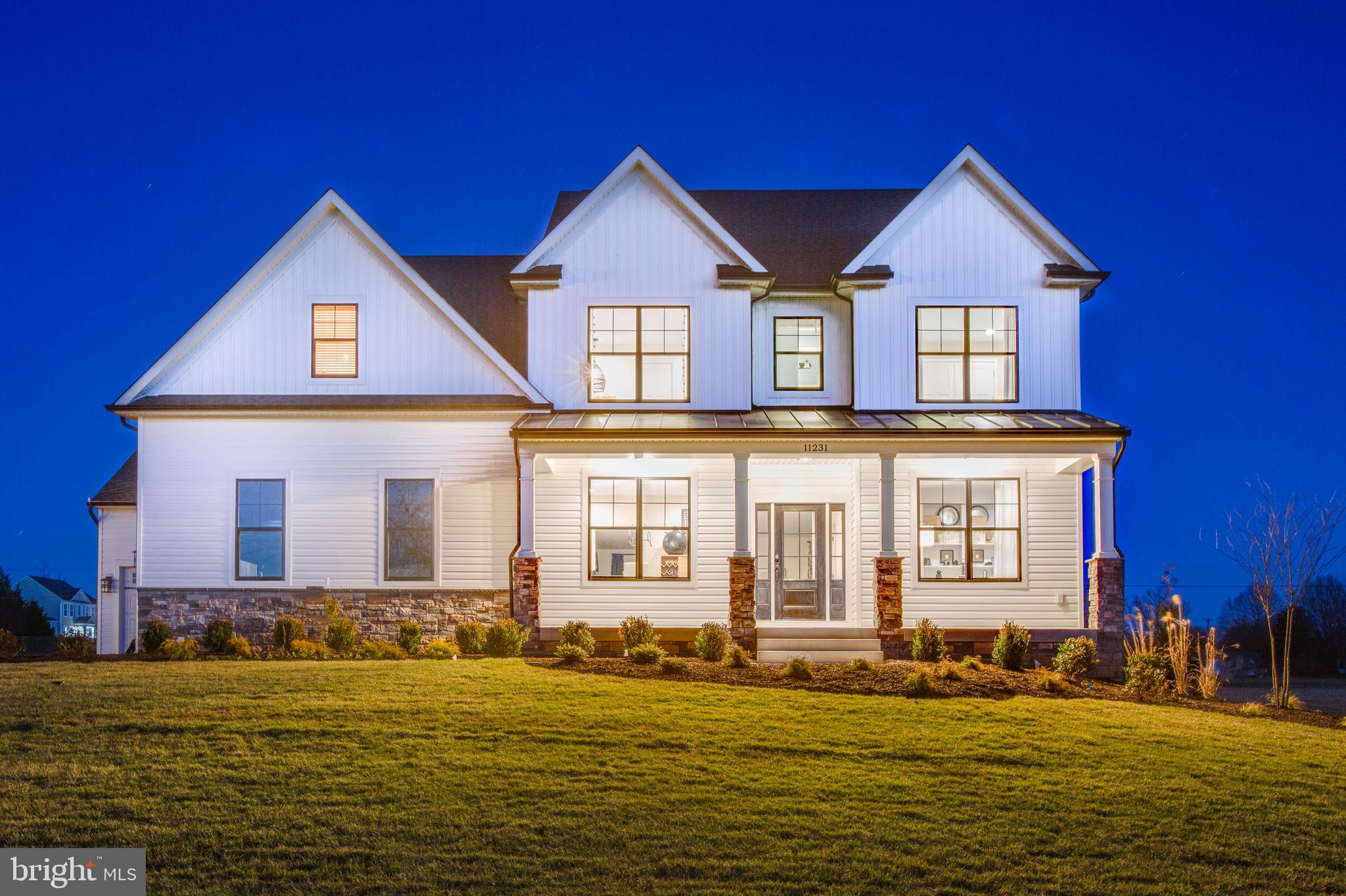 To Be Built by Westbrooke Homes on 6.5 wooded acres with deeded boat slip on Rosier's Creek, minutes to the Potomac River. The Rosslyn from our Executive Series offers 2,900 square feet of thoughtfully designed living with 9-foot ceilings on the main level, 4 bedrooms, 4 full baths, a first-floor guest suite, dedicated study, open-concept great room, and gourmet kitchen with granite countertops, 42-inch cabinetry, and separate cooktop and wall ovens. Luxury vinyl plank flooring throughout the main level. The second floor features a spacious primary suite with walk-in closet, optional tray ceiling, soaking tub, tiled shower, plus three additional bedrooms and second-floor laundry. Unfinished basement with walkout potential and full bath rough-in. Customize your finishes during our Home Personalization process. Rosier's Landing is a waterfront community featuring a cul-de-sac setting with six homesites, a community dock with deeded boat slips on Rosier's Creek, 150 feet of water frontage, and navigable access to the Potomac River. State-maintained roads to the community entrance, high-speed internet available, and minutes from the Route 301 bridge and I-95. Package includes lot, well, septic, site clearing, driveway, landscaping, and erosion and sediment controls. Lot purchased separately from Stoney Point Development LLC. Construction-to-perm financing available. Tour the Rosslyn model at 5229 Windsor Dr, King George. 10-year structural warranty included.