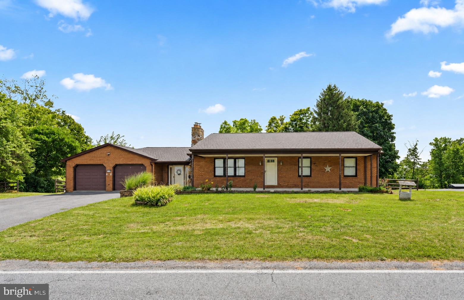 If you've been dreaming of a small homestead with scenic mountain views, here it is!  This beautiful brick rancher offers the perfect combination of peaceful country living and everyday convenience.  Situated on an .83-acre lot, this property has been well cared for and is Move-in Ready! Inside you’ll find a generously sized living room highlighted by a cozy fireplace with wood stove insert and stone hearth — the ideal gathering space for relaxing evenings.  3 bedrooms, 1 bathroom and laundry are conveniently on the main level. The kitchen and dining area are open concept and feature plenty of cabinetry with skylight for natural lighting, stainless steel appliances, granite countertops, reverse osmosis system at kitchen sink for purified water, plus plenty of dining space.  And, don't miss the sunroom addition with mini-split, perfect for relaxing before you step out to enjoy the above ground swimming pool.   An oversized 2-car garage is super clean and right off the breezeway.  A full unfinished basement is a clean slate and offers exceptional flexibility and space that provides future expansion potential, with a 2nd fireplace with wood stove.  Some Upgrades are: roof was just replaced in 2025, water heater is less than 3 years old and above ground swimming pools about 3 years old.   Outside, the back yard is fully fenced and offers space for gardening or animals or simply enjoying rural living.  This a wonderful opportunity to enjoy country living while taking in the mountain views and scenic overlooks.