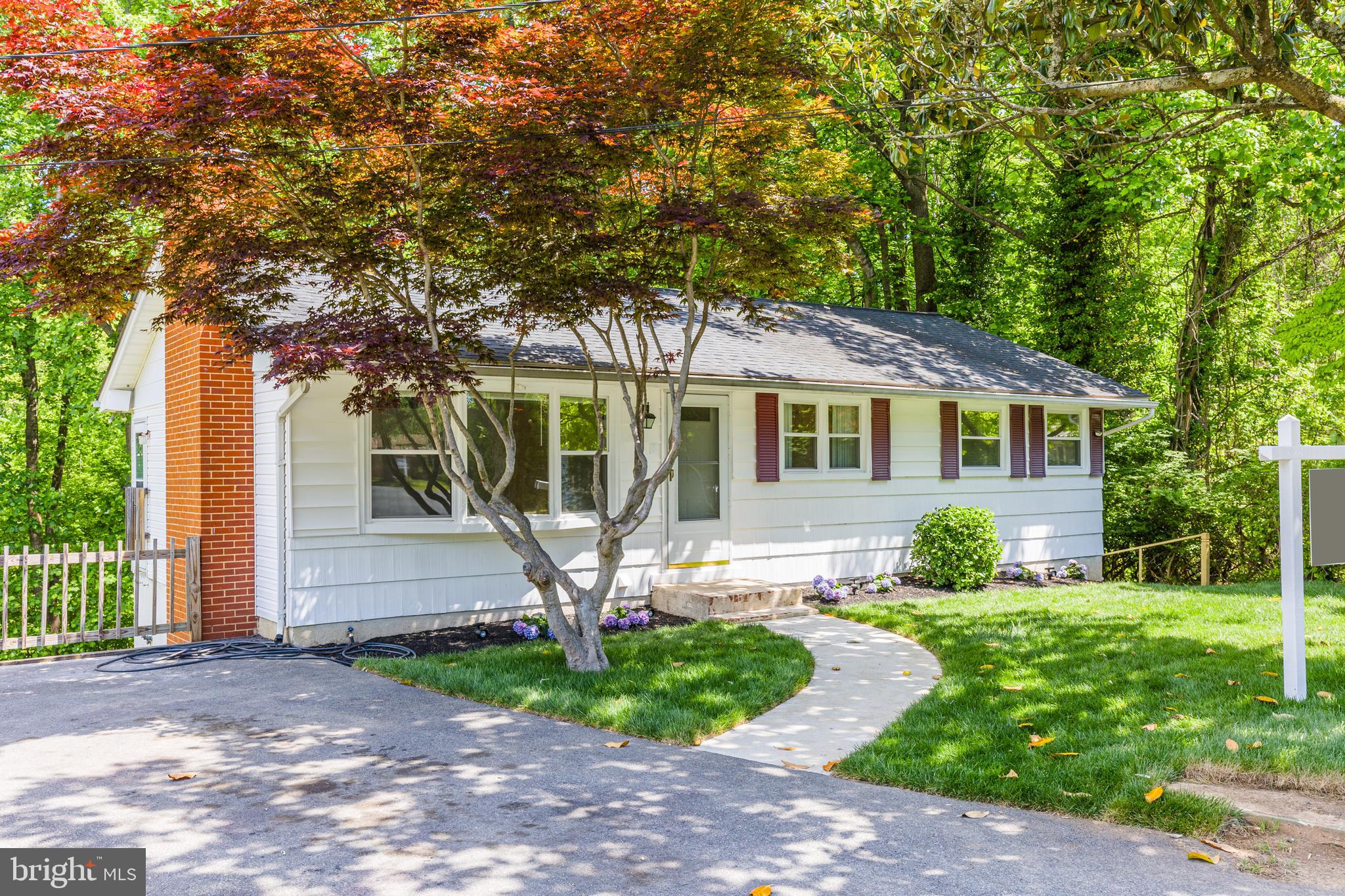 Welcome to this beautifully updated home in the heart of Annapolis, offering the perfect combination of space, flexibility, and opportunity.

Situated on nearly half an acre, this expansive property features 5 bedrooms, 2 full bathrooms, and a layout designed to accommodate a variety of living arrangements. Whether you're looking for space for a growing family, multi-generational living, extended guests, a home office, or potential rental income, this home offers endless possibilities. Seller financing may also be available for qualified buyers, providing a unique alternative financing opportunity.

The main level showcases gorgeous hardwood floors, a bright and inviting living room centered around a cozy fireplace, and a beautifully renovated kitchen featuring white cabinetry, quartz countertops, and a stylish subway tile backsplash. The updated full bathroom boasts modern finishes and elegant tile work, creating a fresh and contemporary feel throughout.

The fully finished walk-out lower level significantly expands the living space and includes its own kitchenette, full bathroom, laundry area, and several versatile rooms that can be used as additional bedrooms, guest suites, office space, a home gym, or recreation areas.

Natural light fills the home, highlighting the spacious rooms and functional floor plan. Outside, the generous lot offers plenty of room for entertaining, gardening, pets, or simply enjoying the privacy and outdoor space.

Conveniently located just minutes from downtown Annapolis, the U.S. Naval Academy, shopping, dining, parks, and major commuter routes, this property offers both comfort and convenience in one exceptional package.