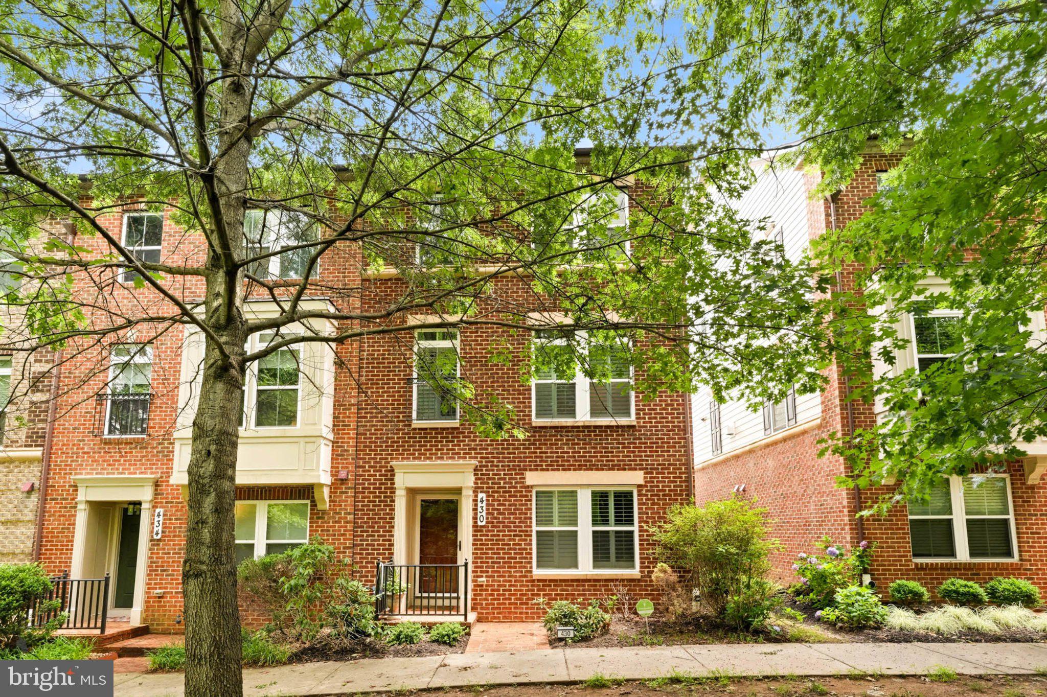 Nestled in the vibrant Watkins Mill Town Center, this charming front facing woods end-of-row townhouse offers a perfect blend of comfort, community, and privacy. Built in 2010, this Colonial-style home boasts 2,300 square feet of thoughtfully designed living space, featuring three spacious bedrooms and two and a half bathrooms. The inviting hardwood floors and granite counter top is perfect for both relaxation and entertaining, highlighted by a cozy fireplace that adds warmth to the living area.  Step outside to discover a community that truly feels like home. Residents enjoy access to a sparkling community pool, ideal for those warm summer days when you want to unwind and connect with neighbors. The well-maintained surroundings and friendly atmosphere make this neighborhood a wonderful place to create lasting memories. The local parks are perfect for weekend picnics, morning jogs, or simply enjoying the beauty of nature. With playgrounds, Tennis court, open green spaces, there's always a place for outdoor fun and relaxation. Convenience is key in this location, with easy access to Highway I-270, I370, and MD 355, Costco, dining, and essential services. Whether you're grabbing a quick bite or indulging in a leisurely shopping spree, everything you need is just moments away. The community is well-connected, making commuting a breeze and allowing you to enjoy all that the surrounding area has to offer. This townhouse features an attached rear-entry TWO car garage and a driveway to fit 3rd and 4th car. The brick exterior enhances the home's curb appeal and also ensures durability and low maintenance. You'll have just the right amount of outdoor space to enjoy without the burden of extensive upkeep. This home is not just a place to live; it's a lifestyle waiting to be embraced. Don't miss the opportunity to make this inviting townhouse your own and become part of a community that truly feels like home.