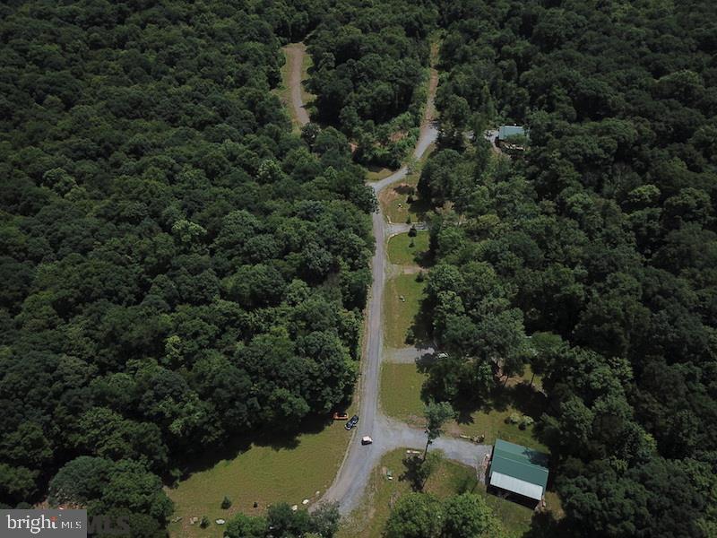 This is a GREAT opportunity to build your special cabin. Nestled in the Terrace Mountains, these wooded lots are secluded and surrounded by nature, located within one of the few Dark Sky areas in PA. You'll enjoy unbelievable night views of the Milky Way and other star formations. The lots are conveniently located within a 10-minute drive to the southern portion of the 40-mile-long Lake Raystown and a stocked trout stream in Trough Creek State Park. They have easy access from central and southeast PA, Maryland, Virginia, and New Jersey, and for Penn State fans the University is a pleasant 60-mile drive.

What sets these lots apart is their unique connection to over 5,000 acres of State Game Land. You have the freedom to choose your own builder. Moreover, they come equipped with public sewer and underground utilities for each lot. There is a connection fee of $6,000 per lot to cover the reimbursement of the seller for providing public sewer and underground utilities up to the lot corner. Additionally, the tap fee for connecting to the public sewer is $1,800. These lots have easy access from southeast PA, New Jersey, and Maryland. They have all been legally subdivided and are ready for immediate development.