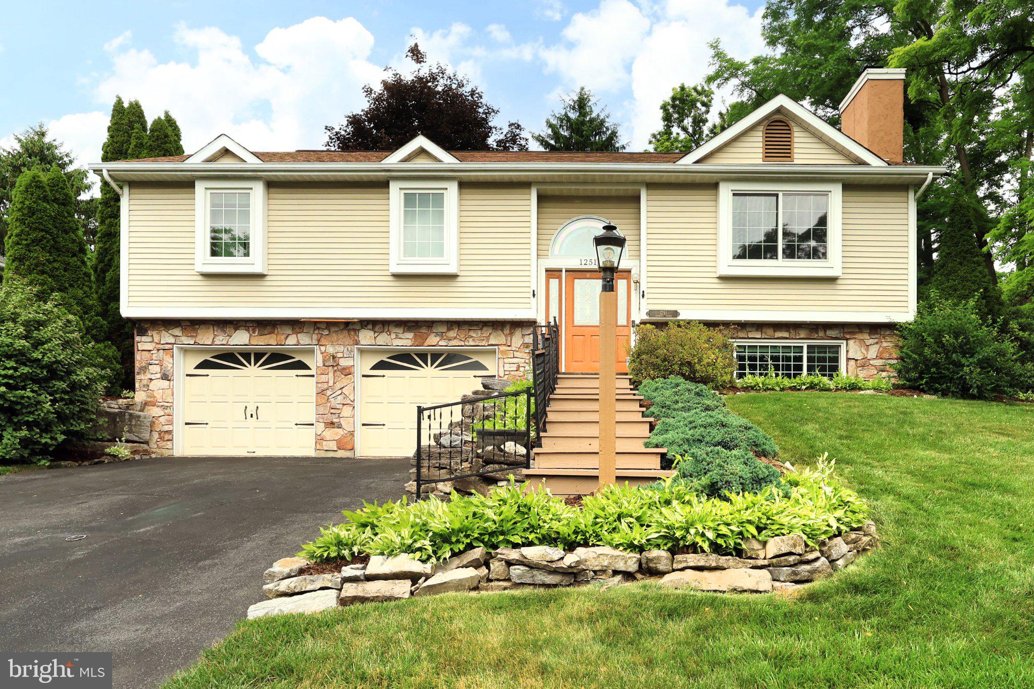 Nestled in the serene Centre Hills Village, this well-maintained bi-level residence offers the perfect blend of comfort and style. Natural light floods the entryway and living room as you walk inside, complemented by the vaulted ceilings, newer carpeting and a beautiful stone fireplace, perfect for warmth and relaxation on those chilly evenings. The heart of the home is the recently remodeled kitchen/dining room featuring added cabinetry with new pantry and wine cooler, energy efficient appliances, and a new wood floor making the kitchen both functional and stylish. The upgraded countertops elevate your culinary experience, while the convenience of an instant hot water system adds a touch of luxury to your daily routine. The dining room slider opens up to a covered deck, perfect for indoor-outdoor entertaining. The spacious rear deck is great for quiet evenings and the awning provides cool shade on those warm summer days. The deck railing has been recently replaced with cabling to allow unobstructed views of the beautiful back/side yards. The other half of the main floor boasts a large primary bedroom with ensuite, two additional generously sized bedrooms and a full hall bath with tub/shower. The lower-level family room has charming built-in bookcases and the room is currently set up with two large screen TV’s, perfect for watching sports or for movie night. Recent modifications created a separate bonus room that is currently set up as an extra bedroom, but could also be a home gym or additional storage space. Rounding out the lower-level is a convenient half bath and the utility/laundry area. The oversized two car garage contains a new workbench area to stay organized along with added power outlets. Beautiful landscaping surrounds this spacious corner lot home. The large backyard also includes a convenient storage shed and a new split rail fence has been installed around the back and side yards. Enjoy gorgeous views of Mt Nittany in a peaceful neighborhood setting, while still being just minutes away from Beaver Stadium, Penn State, and downtown State College. Schedule your private tour today!