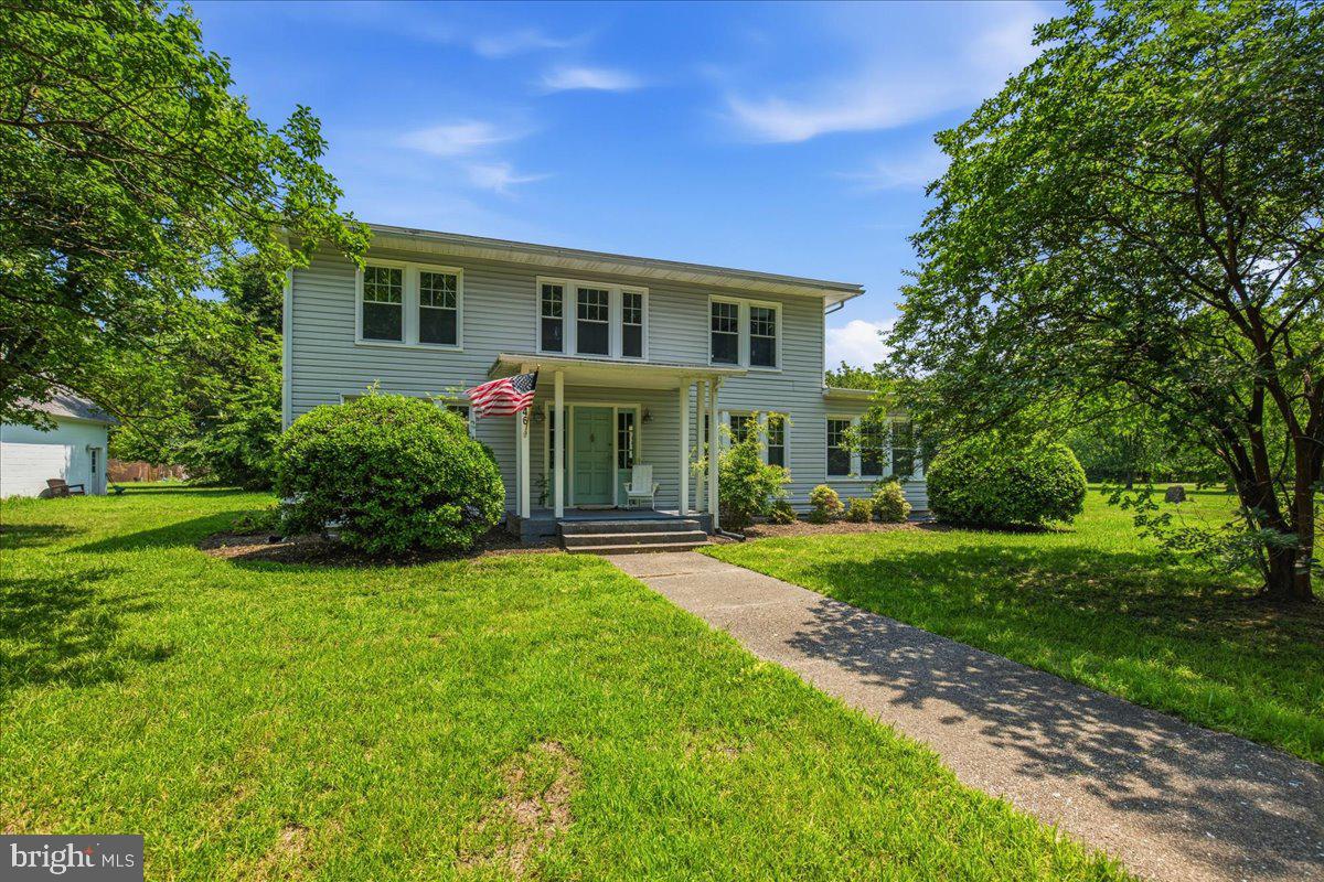 Live the Chesapeake Bay lifestyle on historic St. George Island! This beautifully renovated waterfront Colonial sits on 2.2 private acres with 40 feet of waterfront on St. George Creek, offering spectacular sunset views, a private pier (2019), and direct access to boating, fishing, crabbing, and kayaking.

Originally built in 1927 and renovated in 2018, the property features a 3BR/2BA main home with an open floor plan, cozy fireplace, water-view primary suite, and dedicated home office. Above the oversized detached garage is a private 1BR/1BA guest suite, perfect for guests, multigenerational living, a home office, or rental income. The oversized garage, attached carport, and expansive grounds provide plenty of space for hobbies, entertaining, boats, and outdoor toys.

Qualified buyers may assume the seller's VA loan, offering a potential financing advantage. According to the sellers, flood insurance is not currently required, and the home has never flooded based on current and prior owner history. Conveniently located just 20 minutes from NAS Patuxent River, this is a rare opportunity to own a private waterfront retreat with the perfect balance of peaceful island living and everyday convenience.