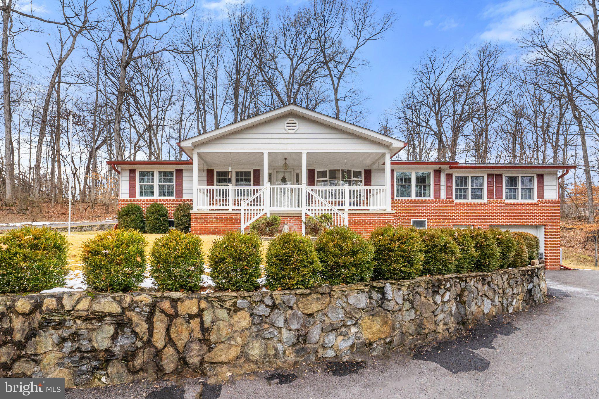 Impeccably maintained 3,300 sq ft rancher featuring a myriad of amenities: Shenandoah River access, 3+ acres, detached workshop/studio, finished basement with potential 4th and 5th bedroom usage, backup Generac generator, office space, and high-speed internet. Spacious rooms abound in this single-level home. Eat-in kitchen features stainless steel appliances, pantry, granite counters, and double sink. The sitting room with a beautiful, Harman woodstove on slate flooring with a brick backsplash, creates a cozy corner to retreat from frigid winter nights. The breakfast room, adorned with wood, cathedral ceiling and Tiffany-style ceiling fan light, is sure to impress. With numerous rooms and a full bath in the basement, the property offers versatile options for multi-generational living or work-from-home setups. Sale includes lots 45-46 totaling 2.77 acres.