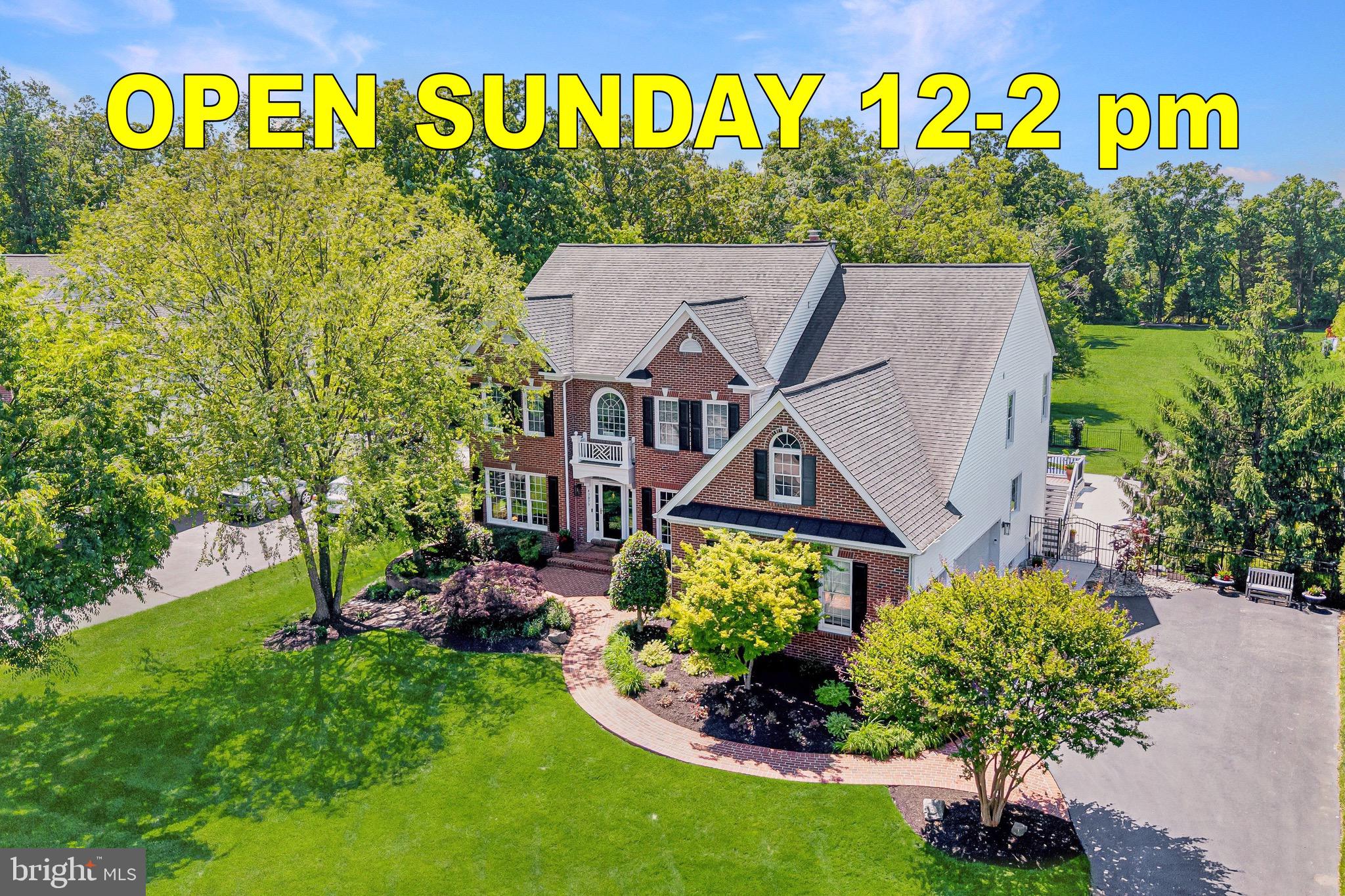 This exceptional brick-front Colonial estate blends timeless elegance with resort-style living, creating an extraordinary retreat where luxury, comfort, and unforgettable entertaining come together seamlessly. Perfectly positioned on a beautifully landscaped 0.46-acre tree-lined homesite, the property offers remarkable privacy while delivering an incredible indoor and outdoor lifestyle. Featuring six bedrooms, five and a half bathrooms, and four finished levels, every space has been thoughtfully designed for both grand entertaining and everyday living.
<br><br>
The curb appeal is undeniable from the moment you arrive, with mature landscaping, manicured gardens, and a stately three-car side-load garage creating a memorable first impression. Beyond the front entry, the backyard transforms into a private outdoor sanctuary designed to feel like a luxury vacation destination. The sparkling pool serves as the centerpiece, surrounded by an expansive sundeck perfect for lounging in the sun. A charming gazebo provides a shaded retreat, while a custom firepit area framed by retaining walls creates the ideal gathering place on cool evenings. Separate grilling and entertaining areas offer endless opportunities for hosting family and friends. The upper-level deck with retractable awning overlooks the beautiful setting below, while the expansive lower patio creates yet another destination for relaxation with granite-topped gathering bars, extensive seating areas, outdoor refrigeration, icemakers, and room for celebrations large and small.
<br><br>
Inside, a dramatic foyer makes a stunning first impression, framed by formal living and dining rooms and enhanced by elegant trim work, detailed moldings, and a sweeping staircase. A private home office with custom built-ins provides the perfect work-from-home environment.
<br><br>
The kitchen serves as the heart of the home and was designed with both beauty and function in mind. Stunning quartz countertops, premium appliances, abundant prep space, and an exceptional walk-in pantry with custom built-ins and tailored organization create a space that is as practical as it is impressive. The adjoining morning room fills with natural light and provides direct access to the rear deck, while the spacious family room is anchored by an impressive stone fireplace.
<br><br>
Upstairs, the luxurious primary suite serves as a private retreat featuring cathedral ceilings, a spa-like bath with soaking tub, dual vanities, and an oversized frameless glass shower. Two expansive walk-in closets with custom built-ins and a dedicated dressing area complete the suite.
<br><br>
The secondary bedrooms are equally well appointed, with one offering a private ensuite bath while two additional bedrooms share a spacious hall bath. An upper-level laundry room adds everyday convenience. The finished attic level offers exceptional flexibility with a bedroom and full bath, creating the perfect teen retreat, guest suite, or private lounge space.
<br><br>
The fully finished lower level elevates the home's entertainment experience even further. A custom built-in bar features a kegerator, beverage refrigerator, dishwasher, and icemaker, creating an impressive hospitality space. A dedicated movie room with projector and screen provides an authentic theater experience, while a spacious game room and exercise room add versatility. The lower level also includes a private bedroom with attached full bath and a second laundry room, making it ideal for guests or extended stays.
<br><br>
Additional major updates provide peace of mind, including a roof replaced with top-of-the-line 50-year wind-resistant shingles, along with recently replaced HVAC systems and water heater.
<br><br>
Perfectly positioned just 0.9 miles from the Metro with immediate access to the Toll Road and moments from Dulles International Airport, this remarkable residence delivers luxury living and exceptional convenience for commuting, travel, and everyday life.