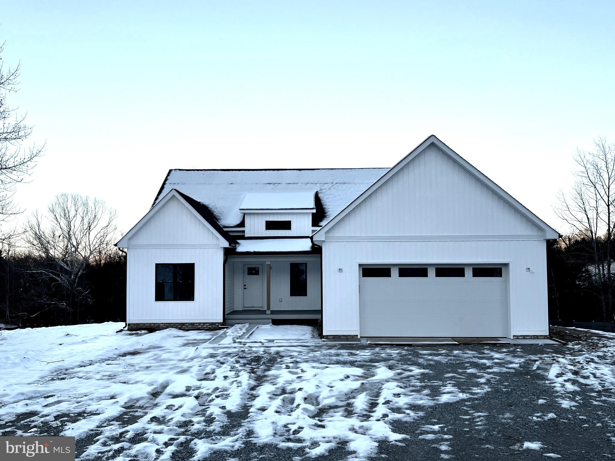 Welcome to your new  LAKE ACCESS, one-story  dream home at 244 Seclusion Drive in Lake Anna, VA! This modern farmhouse features an open floor-plan, 3 bedrooms, and 2.5 baths, making it the perfect place to call home. Upon entering through the welcoming 8 x 14 front porch, find a spacious living and dining area with soaring ceilings and plenty of natural light. The kitchen is a chef's dream, with stainless steel appliances, granite countertops, and a large island. Off the kitchen is the  spacious dining area &  family room  with vaulted ceilings & a gas fireplace, perfect for relaxing on a cold winter night. The primary suite features  a walk-in closet and beautifully appointed private bathroom. There are also two additional bedrooms which share a full bathroom on this level in addition to a half bath for guests. The back porch  is an entertainer's paradise,  measuring 21 x 12 with a beautiful rural view and privacy.  Other builder extras include conditioned crawlspace, 42" sidewalk, & composite decking on front & back porches. This home is located in a quiet neighborhood and is just around the corner from the community lake access. Community area features a sandy beach, gazebo, dock and boat ramp. Enjoy the serenity and seclusion of the area while maintaining proximity to all the amenities that Lake Anna has to offer, including restaurants, wineries, breweries, and boat ramps. Current phase of construction:  ceramic installed. Siding color = white w/black window trim. Expected finish date: JANUARY 15, 2024.