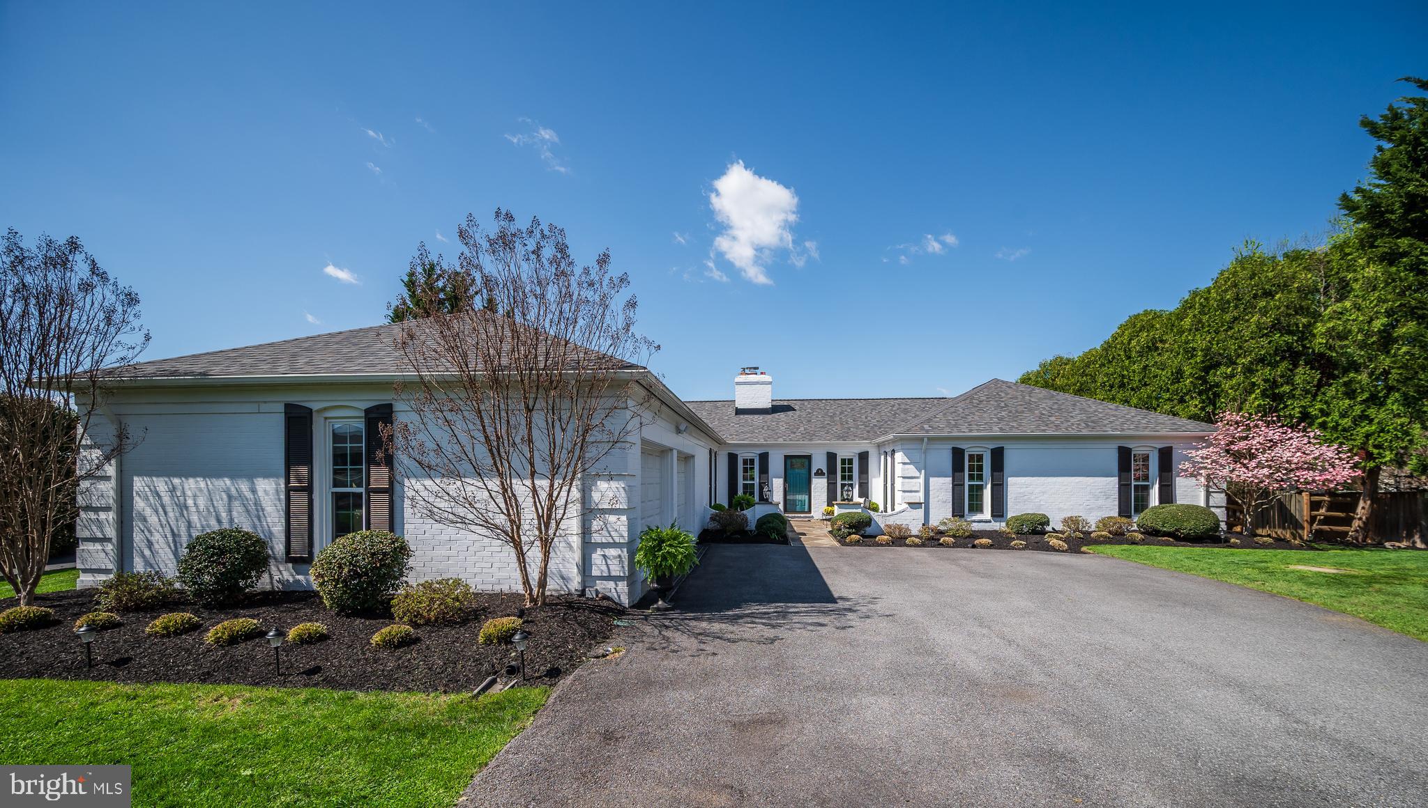 An exceptional opportunity awaits you in the sought-after Quail Run community. Nestled on a lush nearly half-acre lot, this custom crafted, all-brick residence offers refined one-level living, beautifully curated updates, and an inviting outdoor retreat – all in a superb, convenient location. Originally built by Wohlfarth and thoughtfully renovated, this distinctive home embodies timeless architectural design paired with modern comforts. From the moment you arrive, the home’s striking curb appeal is undeniable, with its classic brick exterior, charming flagstone front patio with brick accent walls, and a gracious front yard framed by mature trees and professional landscaping. The warm and inviting interior blends comfort and understated elegance—featuring rich wood floors, custom millwork, and an abundance of natural light throughout. A welcoming marble-floored foyer, complete with multiple coat closets, detailed moldings, and recessed lighting, sets the stage for sophisticated yet comfortable living. Central to the home’s design, the expanded gourmet Chef’s kitchen elevates everyday living and entertaining. It boasts a large center island with seating and storage, classic white cabinetry with crown molding, quartz countertops, a designer tile backsplash, and premium stainless-steel appliances—including double wall ovens, a gas cooktop, and built-in microwave. A thoughtfully designed coffee/wine bar with glass-front cabinetry and a beverage refrigerator adds both convenience and charm, while a spacious pantry and designer lighting complete this superb gathering space.
The adjoining family room is truly captivating, highlighted by a vaulted ceiling with exposed beams and walls of natural light. French doors open seamlessly to the outdoor side patio. The elegant living room offers a more intimate setting, featuring a gas fireplace and direct access to the stunning screened porch. The main level continues with three generously sized bedrooms and two full baths. The luxurious primary suite serves as a private retreat, offering a spacious bedroom with wood flooring, plantation shutters, ample storage with a large walk-in closet and additional closet. The spa-inspired en-suite bath features a beautifully tiled walk-in shower with bench seating, a large vanity, and custom linen storage, along with a separate dressing area with an additional vanity. Two additional bedrooms also feature rich wood floors, plantation shutters, and generous closet space, and share a well-appointed full bathroom with a shower/tub. Just off the attached two-car garage, you’ll find an updated powder room and a sun-filled mudroom equipped with washer, dryer, utility sink, and built-in cabinetry for everyday convenience. The unfinished partial basement is comprised of a small mechanical area, flanked by two expansive crawl spaces, suitable for storage. The incredible living space extends outside to the expansive screened porch with vaulted ceiling, providing a peaceful setting to relax and enjoy scenic views and sunsets. The private, tree-lined backyard spans nearly half an acre and includes mature landscaping, a side patio ideal for morning coffee, and a fully fenced rear yard—perfect for recreation or quiet retreat. Ideally located in Quail Run, this distinctive home offers easy access to local area attractions including nearby parks, shopping, dining, and major commuter routes—delivering both tranquility and convenience. Substantial updates include new roof (2024), gutters and downspouts (2021), gas furnace and air conditioner (2018), water heater (2016), significant house renovation including kitchen and bathrooms, window replacement, wood flooring, interior paint, shutters (2016), screened porch (2016). Welcome Home!