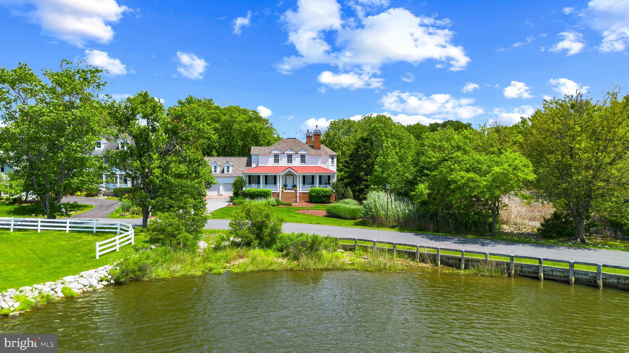 Exquisite Savannah Style custom-built home in sought after, amenities-rich, Fishing Creek Farm community in Annapolis. This non-riparian waterfront home is nestled between 2 bodies of water providing endless water views from almost every room of the house. Wake up early to watch the wildlife and the sunrise over Cherry Tree Cove from the rear screened porch or enjoy peaceful water views and sunsets over Duvall Creek from the relaxing front porch. Upon entering the home the generous Foyer opens onto the formal Living Room with fireplace and custom built-ins and the spacious Dining Room which flows into the beautiful Gourmet Kitchen filled with high-end appliances and charm. The adjacent spacious Family Room and expansive 3 seasons porch overlooking the lush backyard and sparkling water of Cherry Tree Cove are perfect for entertaining. With 4 bedrooms and 5.5 baths including a private and conveniently located guest suite above the garage, there is plenty of space for a large family and the many guests that are sure to come visit in this stunning setting. The fully finished basement boasts an additional living space, game room, play area, full bath and wet bar. The free-standing Office/Studio area provides endless possibilities. The sought after community of Fishing Creek Farm offers a community pool, tennis courts, marina, beach and much more, all just a quick stroll from this amazing property. Located just minutes from downtown Annapolis and Eastport which offer the perfect balance of small-town charm and big world sophistication. Traveling or commuting is just as convenient by easily accessing Rt. 50 and 97 which provides direct access to Baltimore, BWI, Ft. Meade/NSA and Washington, DC., or head over the Bay Bridge to the Eastern Shore for a quick beach vacation. Welcome Home!