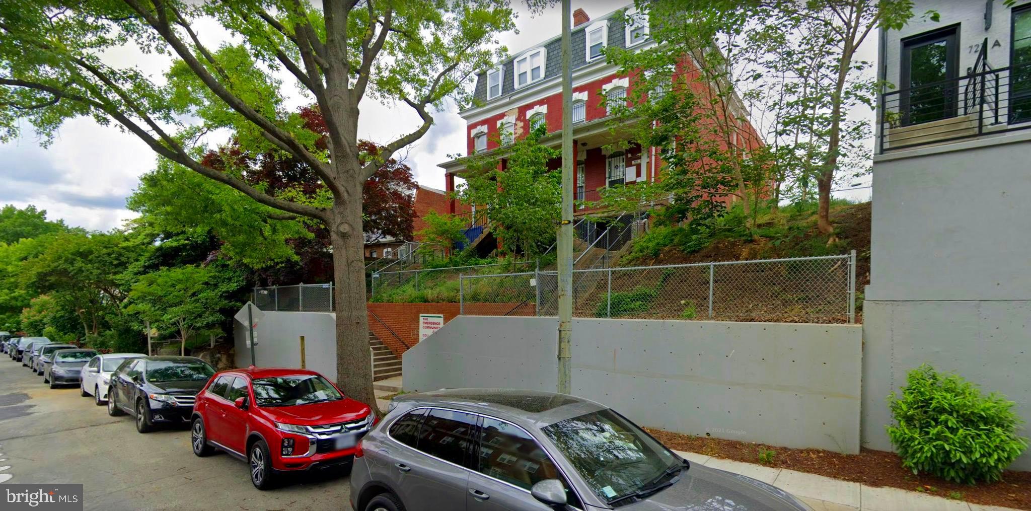 Rare development opportunity in Columbia Heights!  Introducing an approximately 8,400 sf building on an 11,400-sf lot situated approximately 2 stories above the street level for spectacular city scape views and priced for re-development.  This distinctive Victorian Colonial building most recently housed the non-profit, Emergency Community Arts Collective (ECAC) and has a stately south facing façade with a covered front porch and embodies all the charm and elegance of a bygone era. The parking lot area accessible via the alley between Fairmont and Euclid Streets NW has been paved with semi-permeable pavers and added green features include solar panels and a 200+ gallon rainwater reclamation barrel.  Part of the side yards are usable for vegetation and there is a tiered front yard with bifurcated concrete stairs meeting at the lower street level landing and top landing of the covered front porch. Convenient to restaurants (Georgia Ave, 11th Street & U Street corridors), grocery stores (Whole Foods, Giant, Safeway & Trader Joes) coffee shops (Coffee Roasters, Starbucks), gyms (Washington Sports Clubs & YMCA) with a 93-walk score and 92 bike score. Please contact the listers to schedule an agent accompanied walk-through.

History of 731-733 Euclid St NW building: Estimated to have been built in the late 1800s, the original property was four small three story row houses on an 11,400 square foot lot. Over time, the two houses on either side were torn down. The two remaining houses were combined into one and a large two-story addition was added in 1930 when the building opened as the Meriwether Home for Destitute Children. What stands today is a large two-story building with a smaller third story and basement.