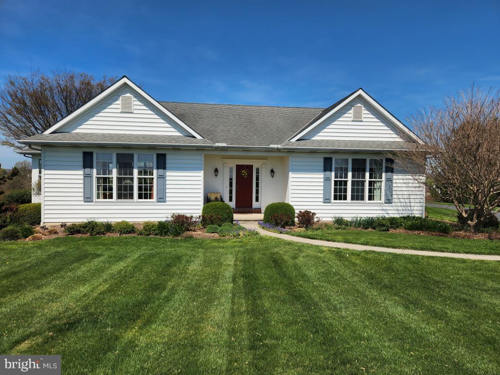 This property will be offered at Public Auction on Saturday, June 13, 2026 @ 12pm.  The listing price is the opening bid only and in no way reflects the final sale price.  10% down due at auction, 2% transfer tax to be paid by the purchaser, real estate taxes prorated. This 2-acre property offers an elevated setting with scenic views overlooking the surrounding countryside, perfectly positioned in a peaceful rural location four miles South of the Buck off 272. The main floor features a welcoming entryway leading into a comfortable layout designed for everyday living. You’ll find a spacious primary suite complete with a private bath and direct access to the laundry area for added convenience. The home also includes a well-appointed kitchen, a generous great room, and a dedicated dining area. A bright sunroom provides additional living space. The side entry opens into a practical mudroom with a half bathroom. Two additional bedrooms are located on the main floor, including one with direct access to the patio, along with a full bathroom. The basement is unfinished and offers excellent storage with built-in shelving, as well as potential for future expansion or customization. The property also features a finished, heated shop space with a firewall, ideal for a workshop or potential third-car garage. It is a great opportunity to own a well-located country property with space, versatility, and beautiful views.
