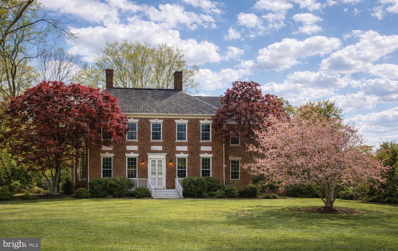 Step back in time with this beautifully preserved historic home in the heart of Princess Anne, where original craftsmanship meets the charm of Maryland’s Eastern Shore. Beckford Manor, circa 1803, is a historic Federal/Georgian brick estate located in the heart of Princess Anne and listed on the National Register of Historic Places. Set on approximately 7.9 acres, this property offers over 5,400 square feet of living space, combining early American craftsmanship with modern comfort. 

The home features 4 bedrooms and 4 bathrooms, with large, well-proportioned rooms, high ceilings, and abundant natural light throughout. Original details include heart pine floors, detailed woodwork, plaster moldings, and eight fireplaces, reflecting the quality and style of the early 1800s. 

Designed for both everyday living and entertaining, the home includes formal living and dining rooms, a spacious kitchen with high-end appliances, and multiple gathering spaces. A private office, guest suite, and two staircases add flexibility and function.

Outside, the grounds are surrounded by mature trees and open lawn, offering privacy and space for outdoor living or events. A historic smokehouse and additional outbuildings remain on the property, adding to its character and history. 

Located just minutes from downtown Princess Anne, this is a rare opportunity to own a well-preserved historic estate with space, presence, and a strong connection to the Eastern Shore’s past.