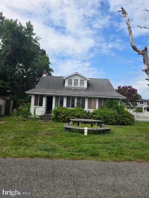 This is an estate sale. Cute 1 BR 1BA cottage located a few hundred yard from the bay. Needs some TLC but livable. Roof is less than 7 years old. Solar panels are owned and not leased. Includes boat slip number 7. Would make a great getaway home or investment property.  Sold strictly "as is".  Seller will make no repairs.
